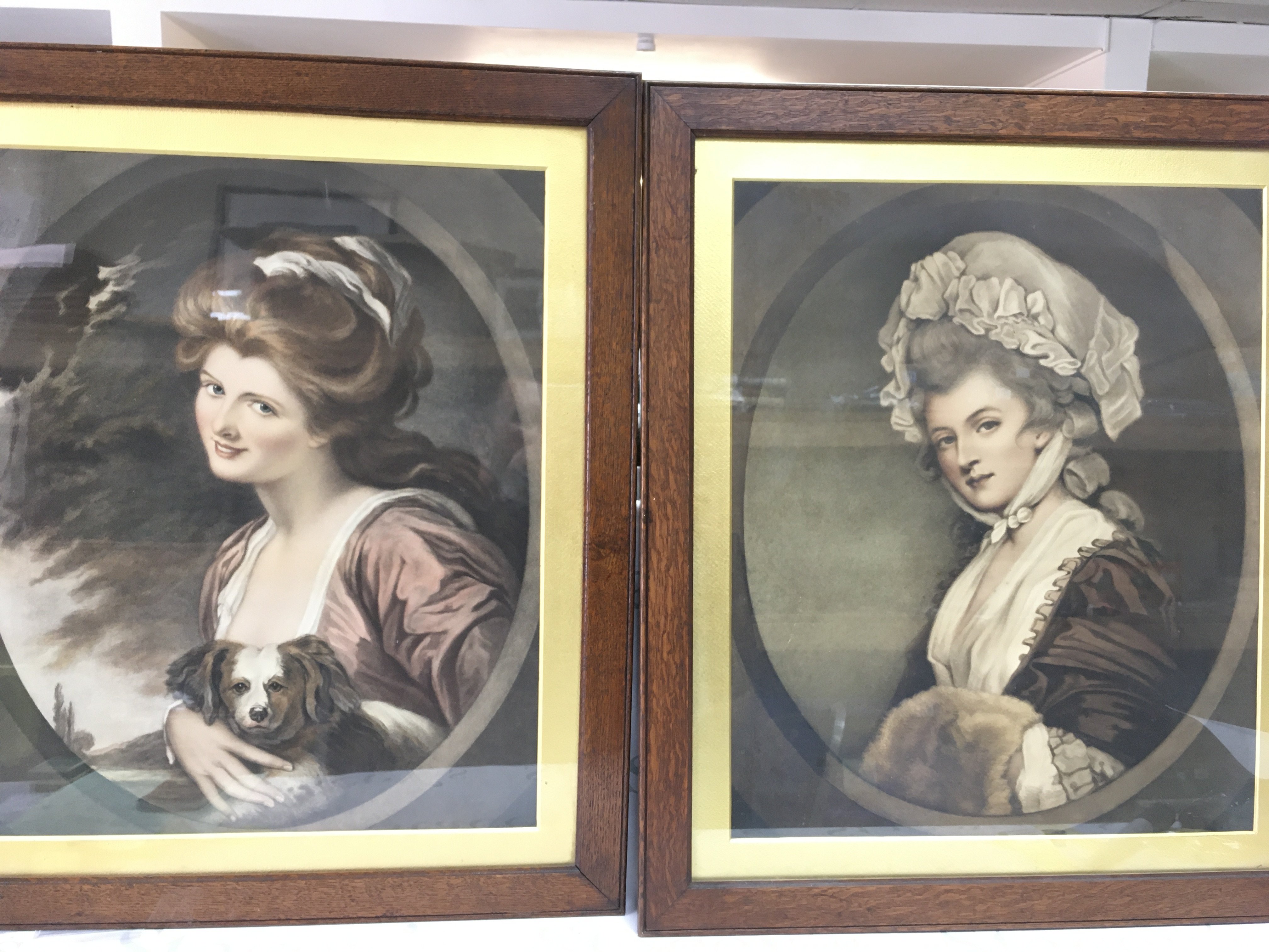 A framed portrait of lady Hamilton showing her with her dog and the other of Mrs Mary Robinson.