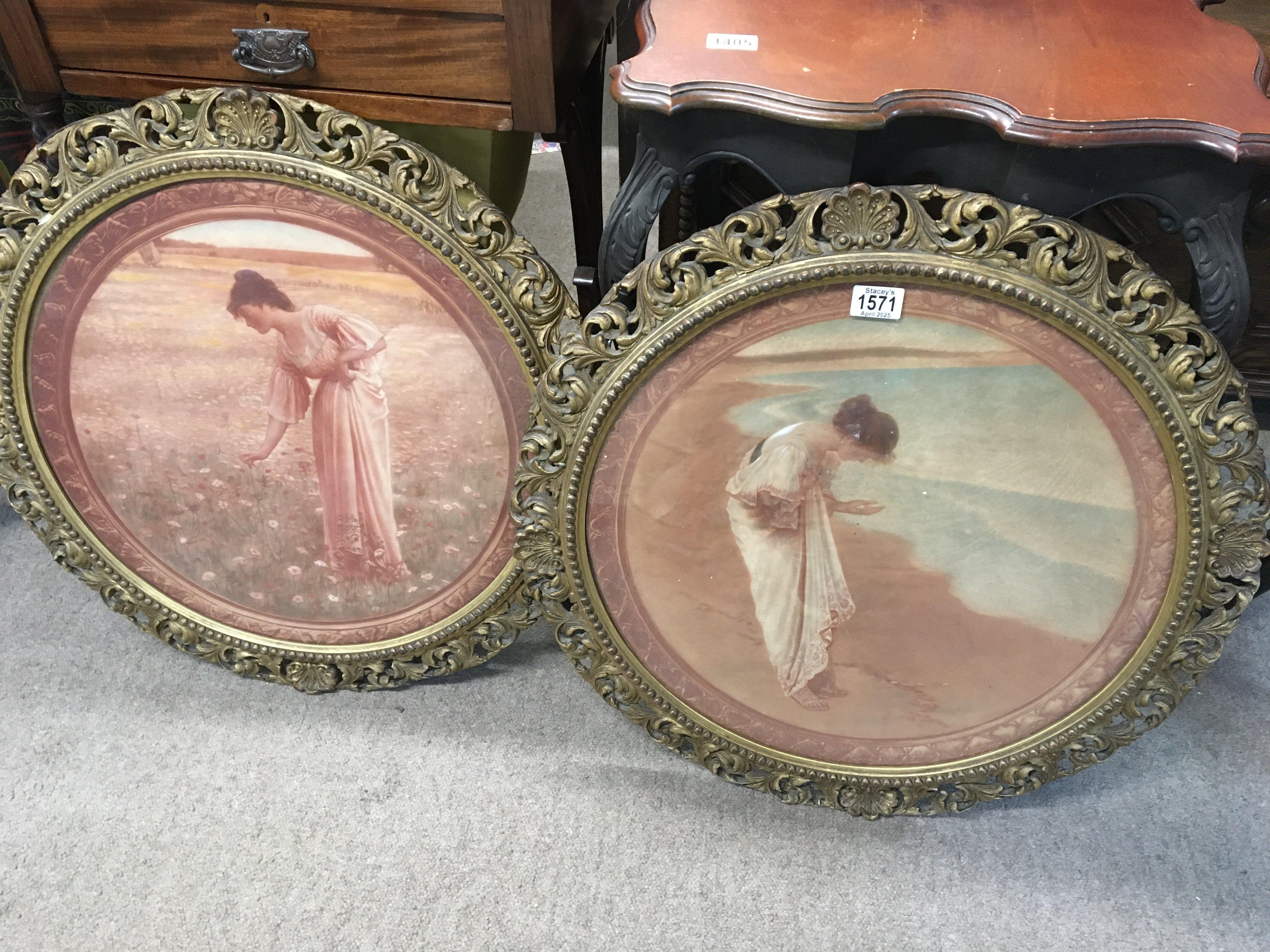 A pair of gilt framed early 20th century prints depicting female full length figures in a poppy field and a figure on a beach diameter 64cm wide.