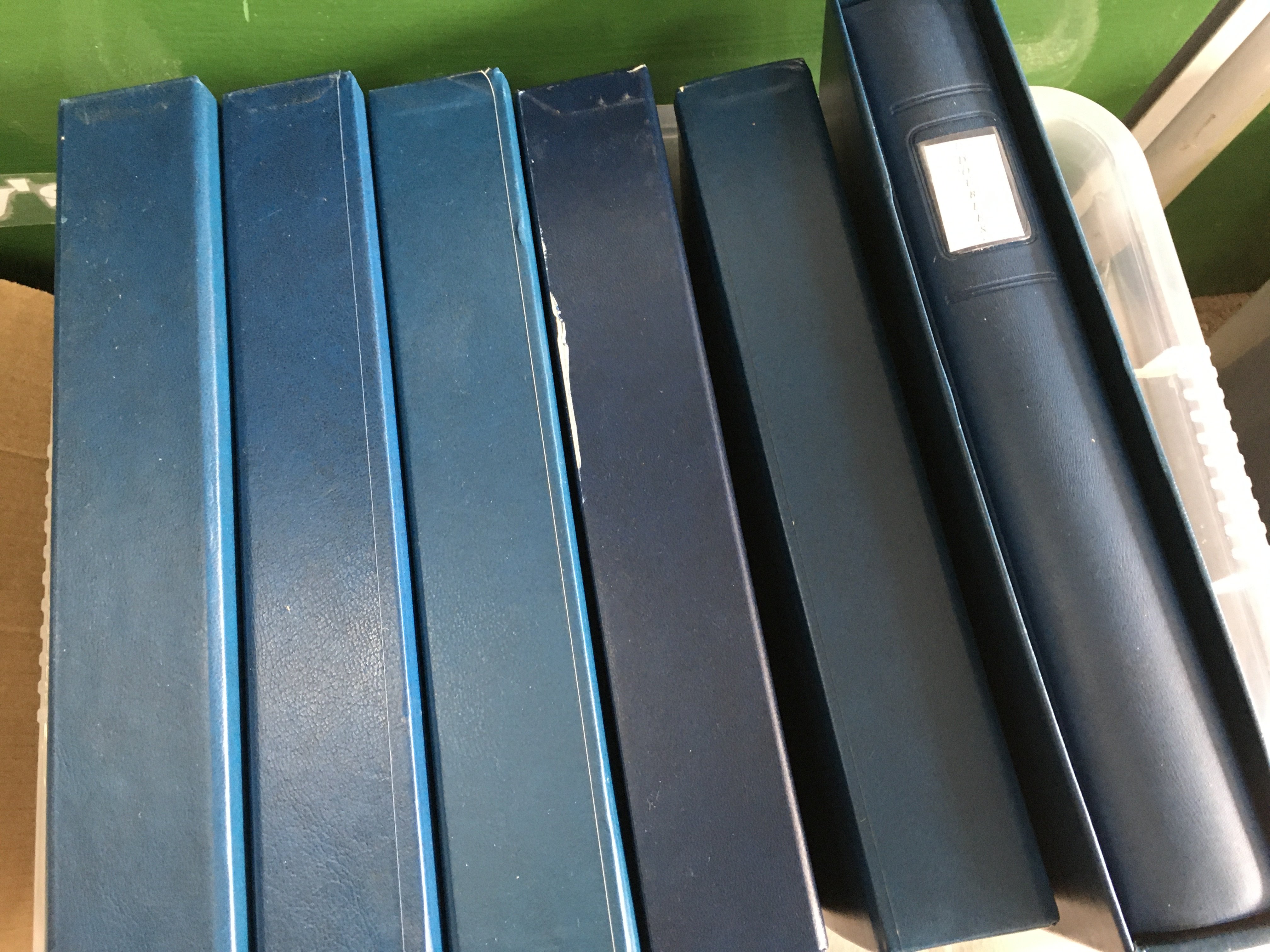 A box containing six albums of jersey stamps .