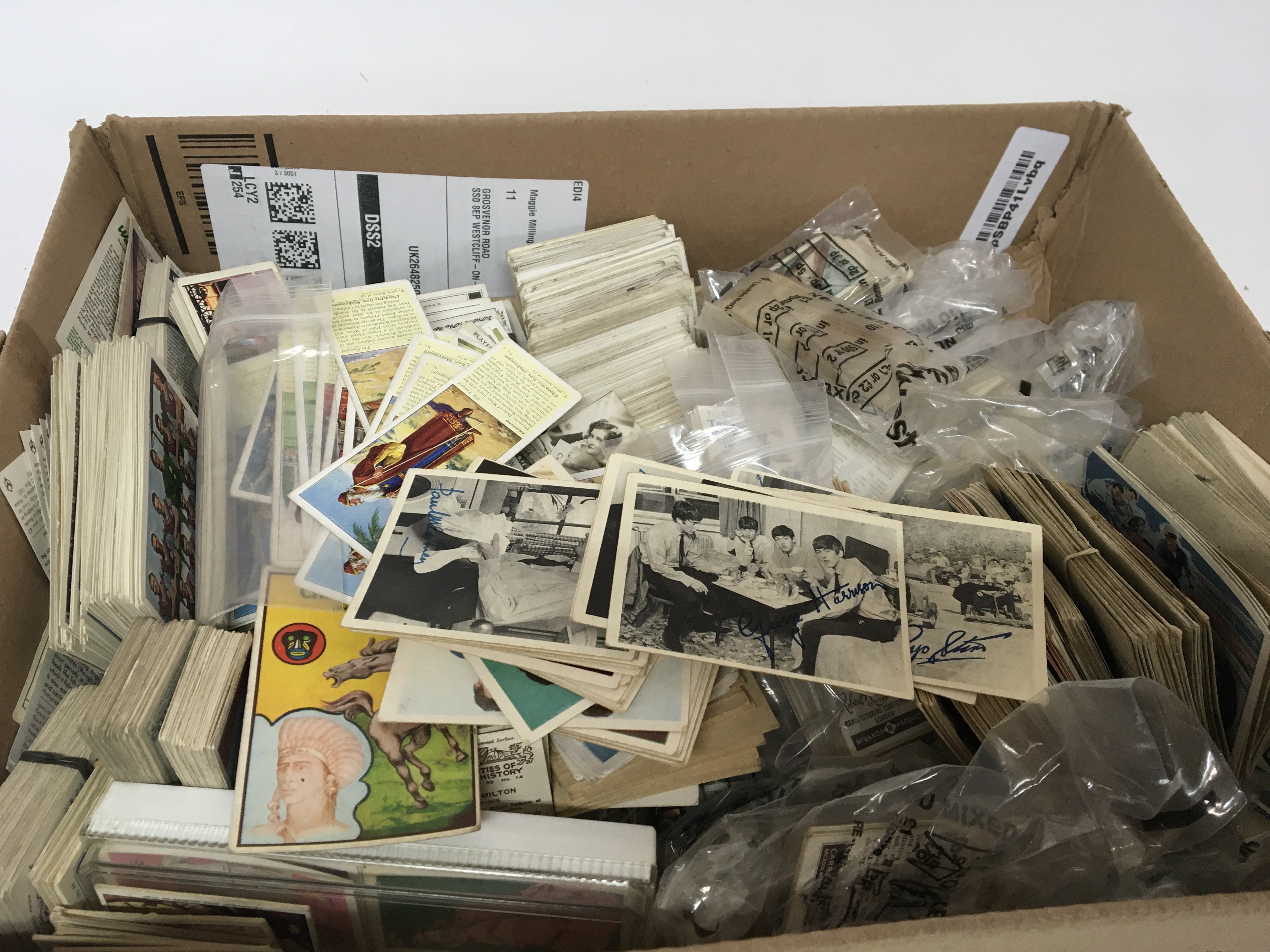 A box containing a good collection of vintage cigarette cards sets and part sets including some interesting 1960s Beatles Cards and soccer team cards