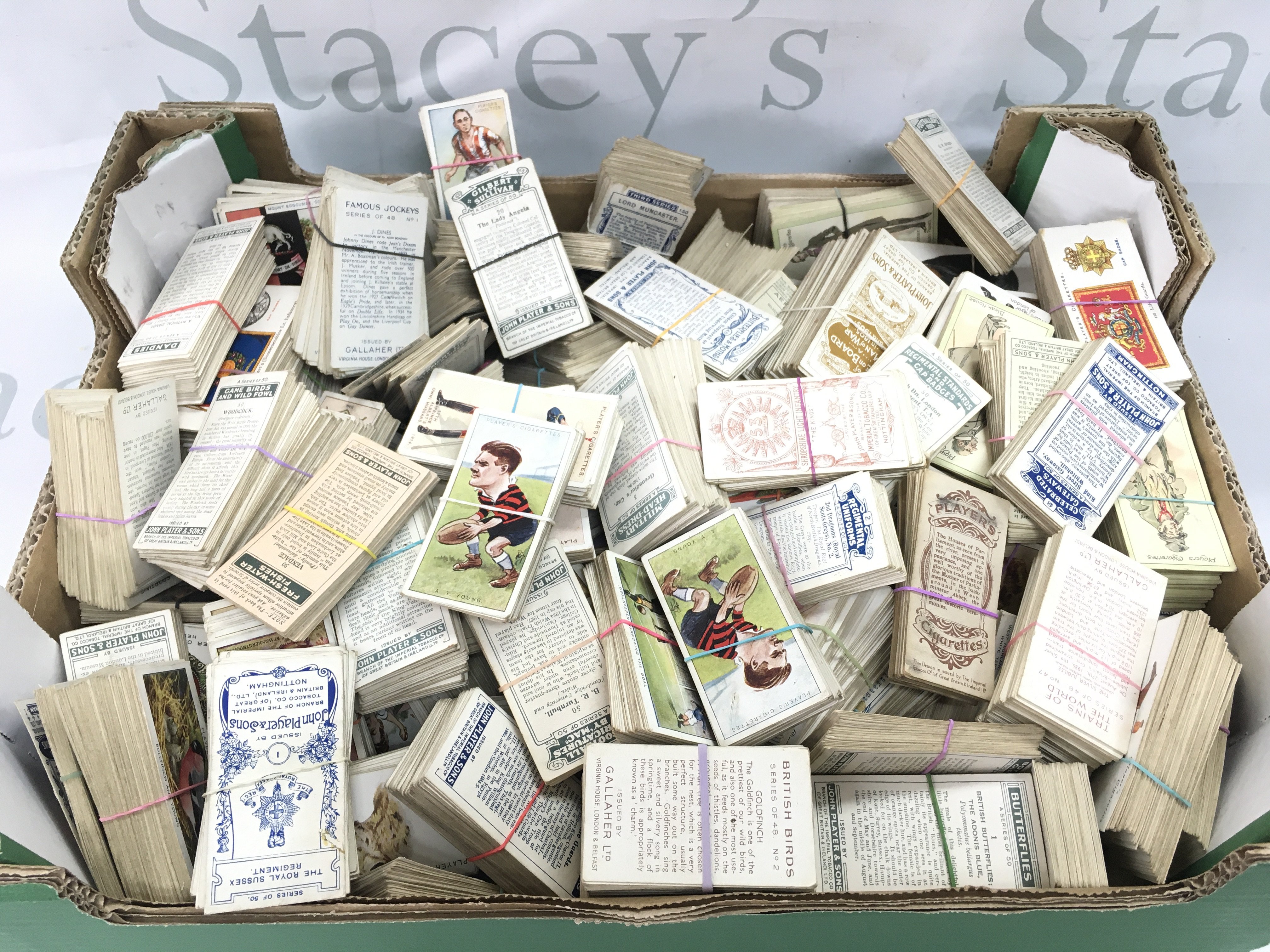 A large amount of Players Gallagher Carreras etc cigarette cards in excess of 1000. Postage B