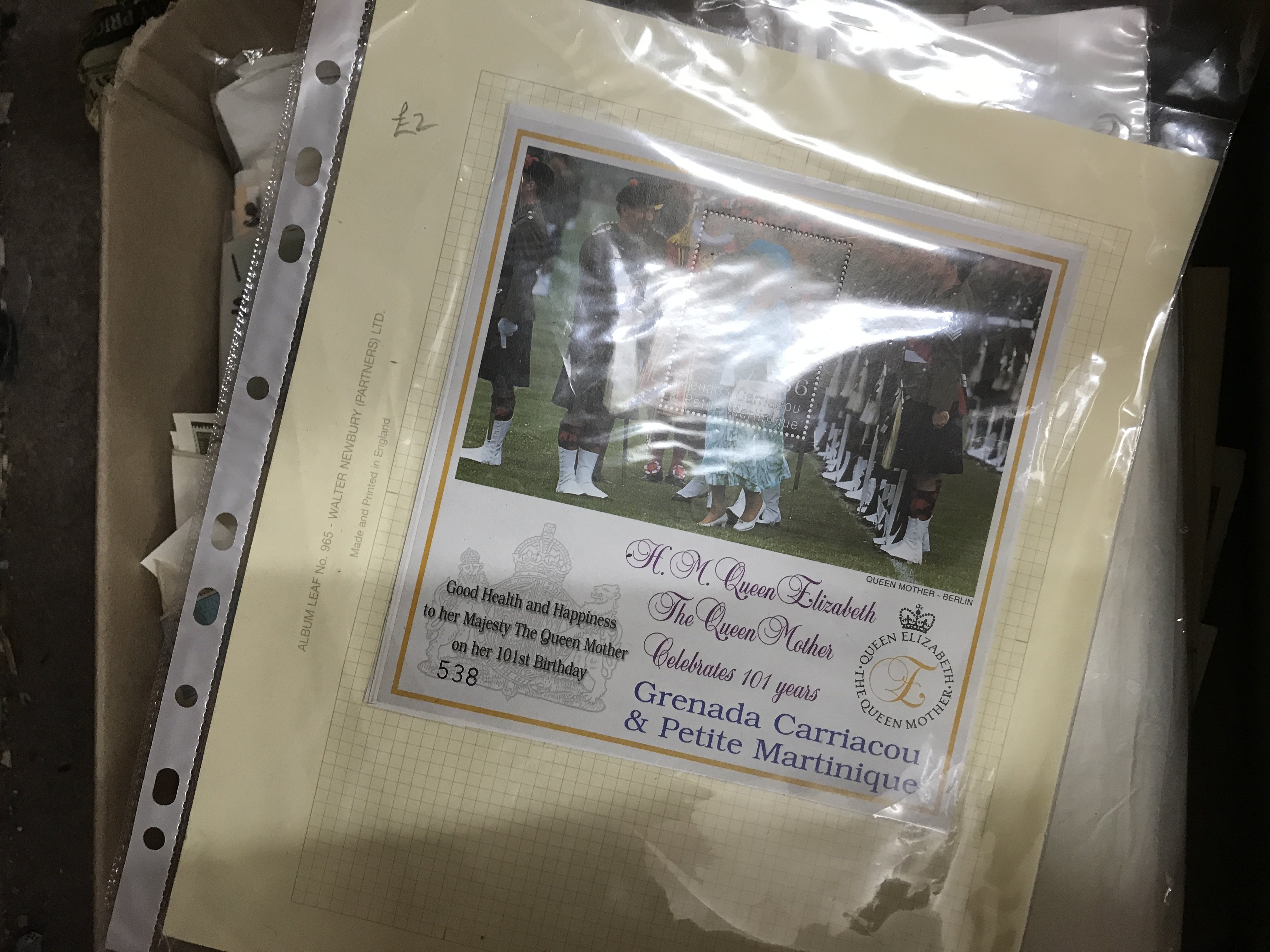 A box of GB and world stamps.