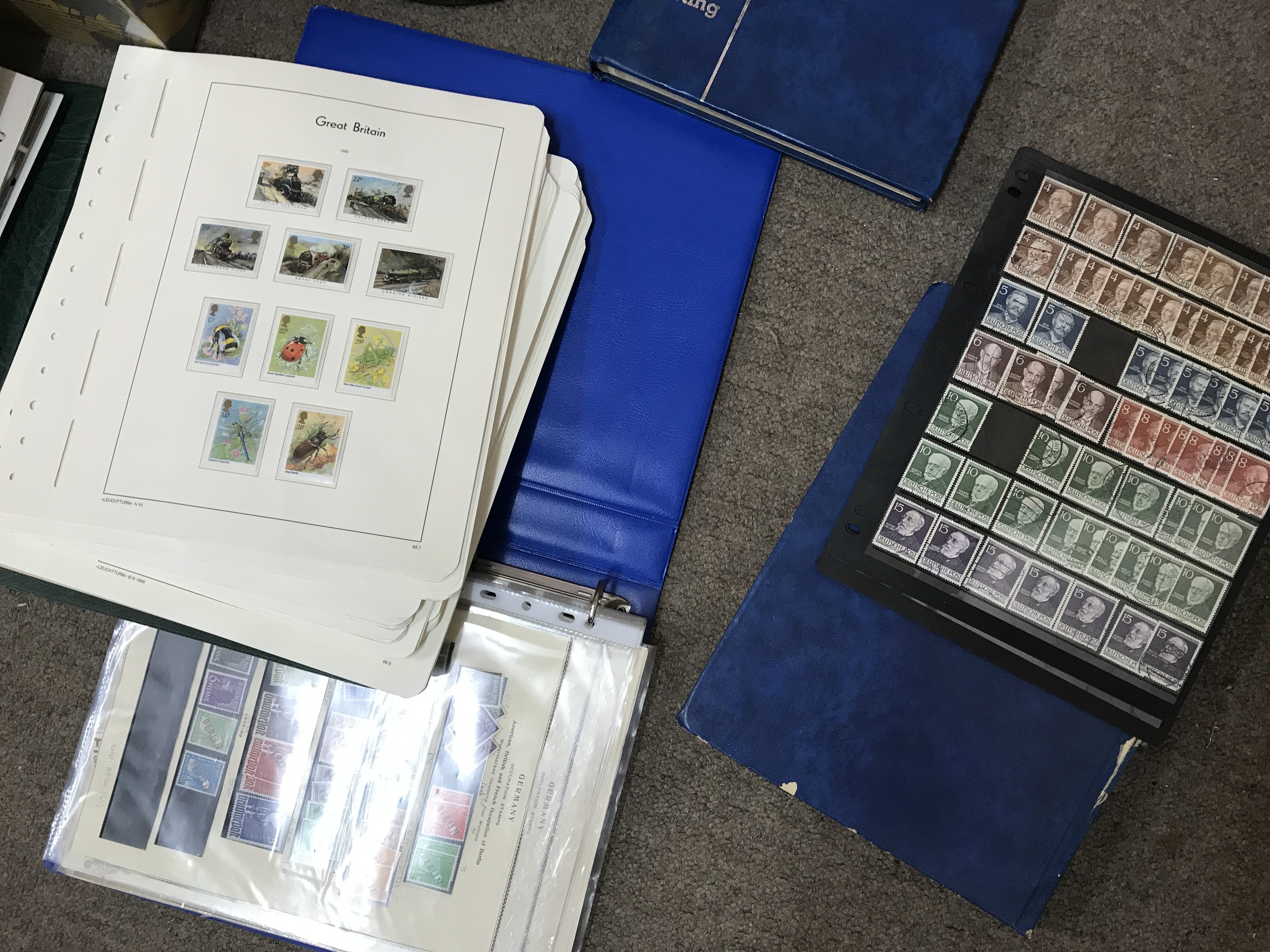 A box containing GB and world stamps.