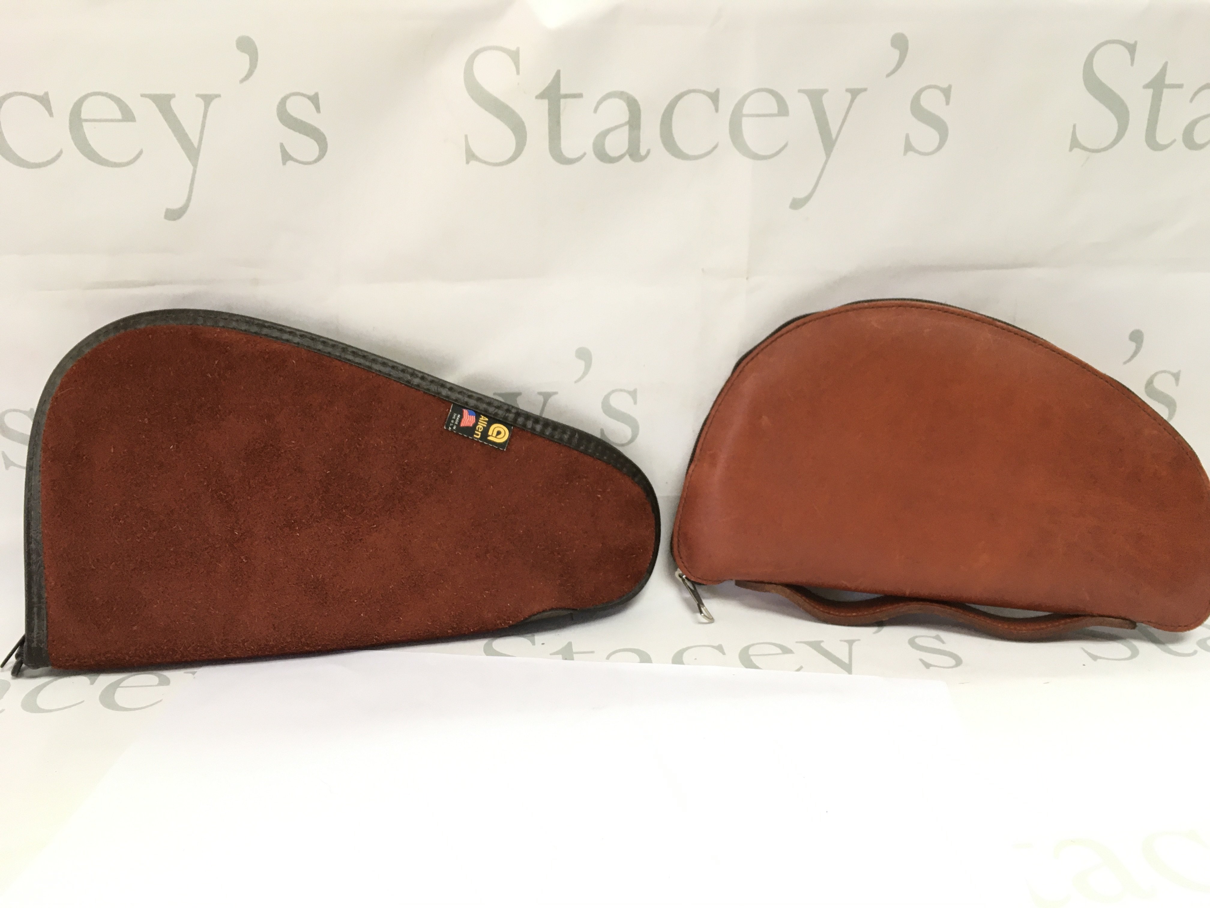 Two leather and sheep skin pistol cases. postage category B