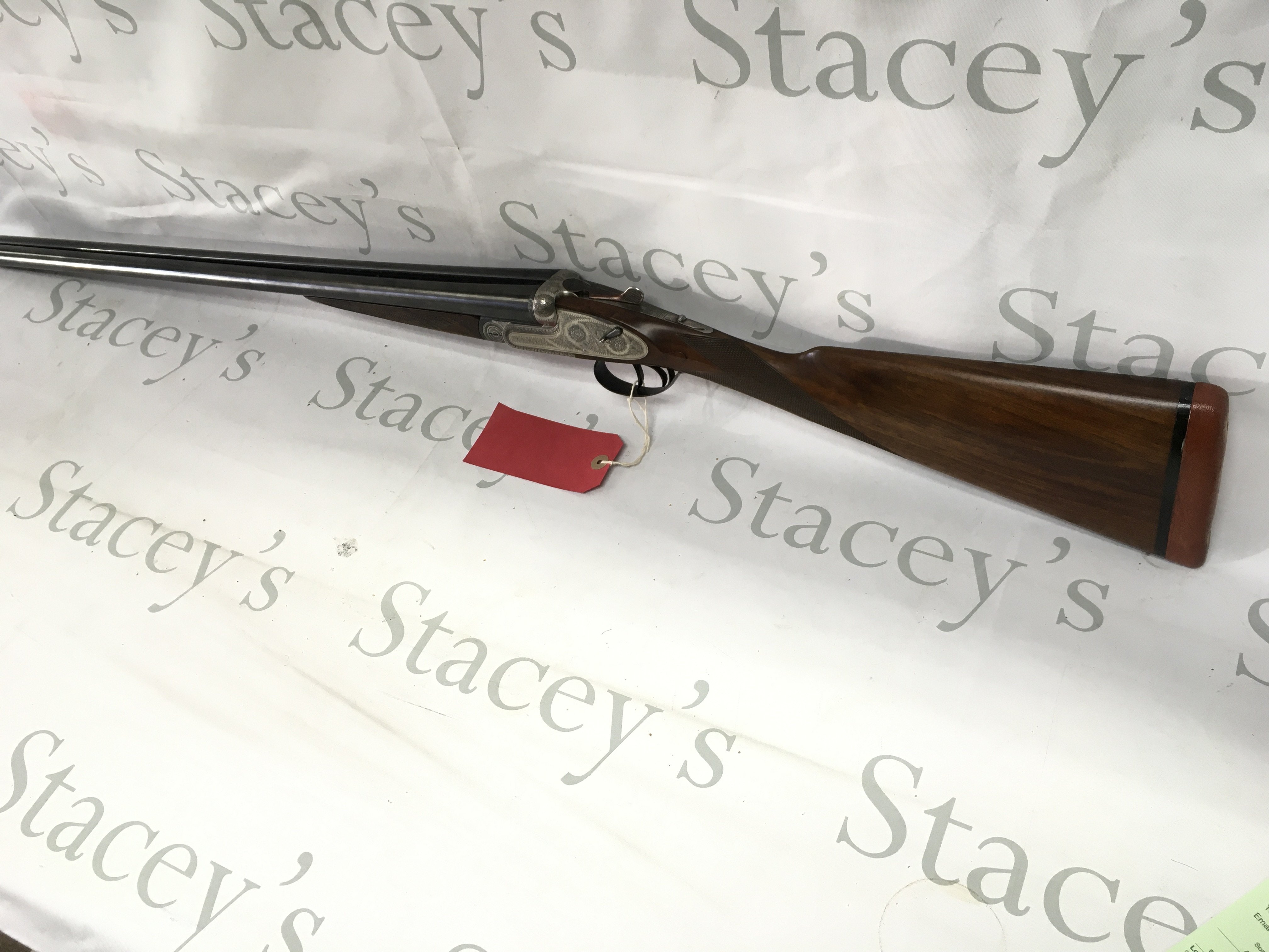 A black Sabel DeLuxe side by side 12g shotgun. 26.75inch barrel and 44.5inches overall length. Twin trigger. A great example of a classic side lock action with removable side plate. PLEASE NOTE THAT A SHOTGUN LICENSE IS REQUIRED TO PURCHASE THIS ITEM. VIEWING AND COLLECTING IS BY APPOINTMENT ONLY.