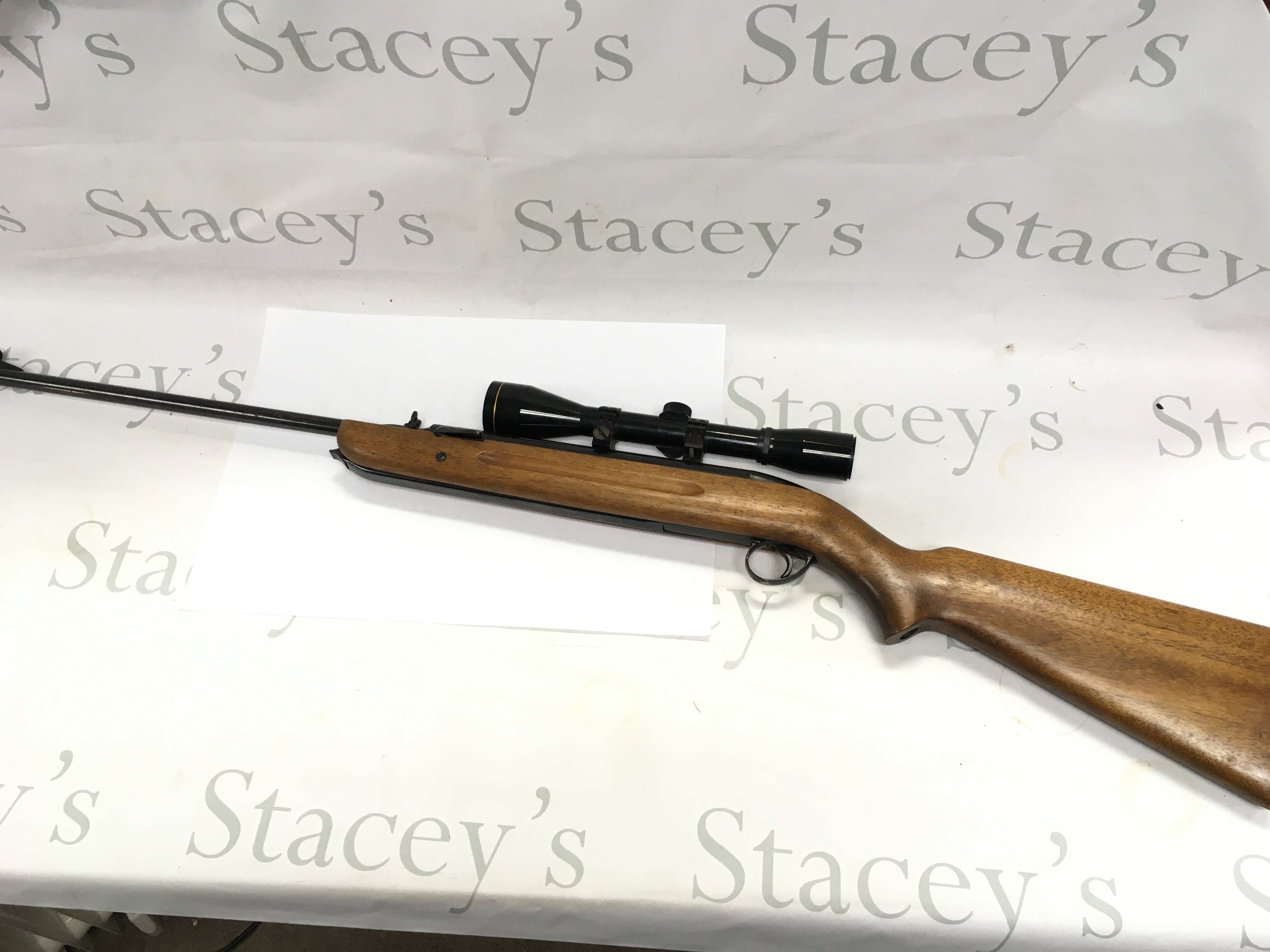 A .22 air rifle with mounted scope. 111cm overall length. Comes with slip.