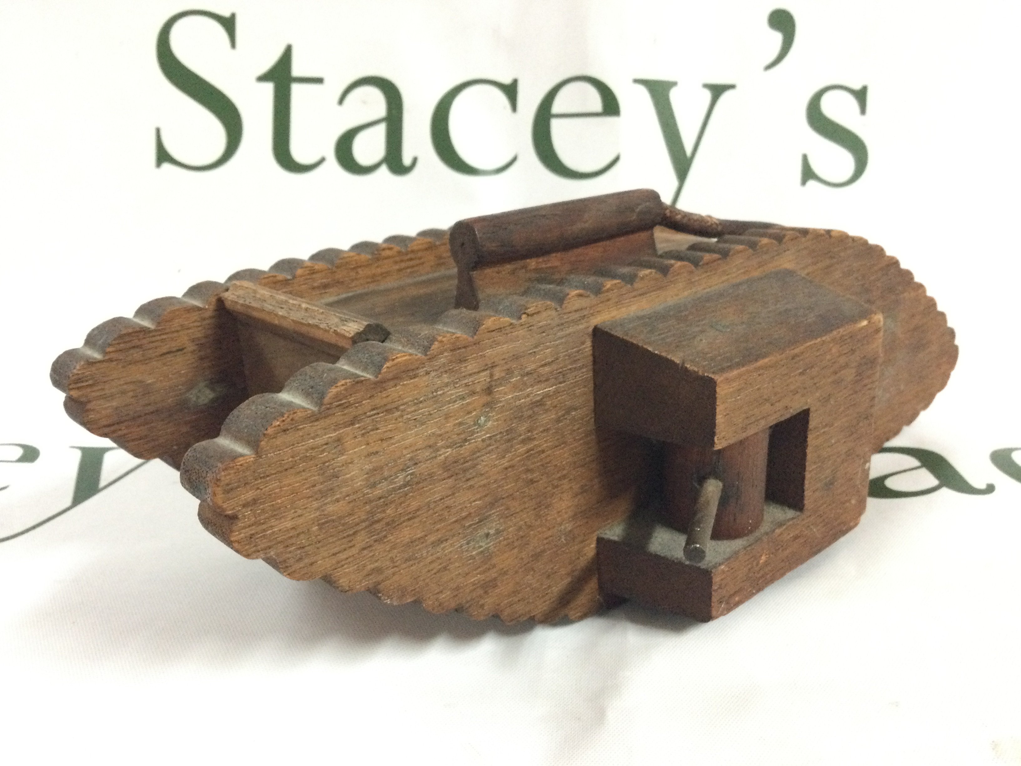 A wooden WW1 trench art Tank money box. Postage category B