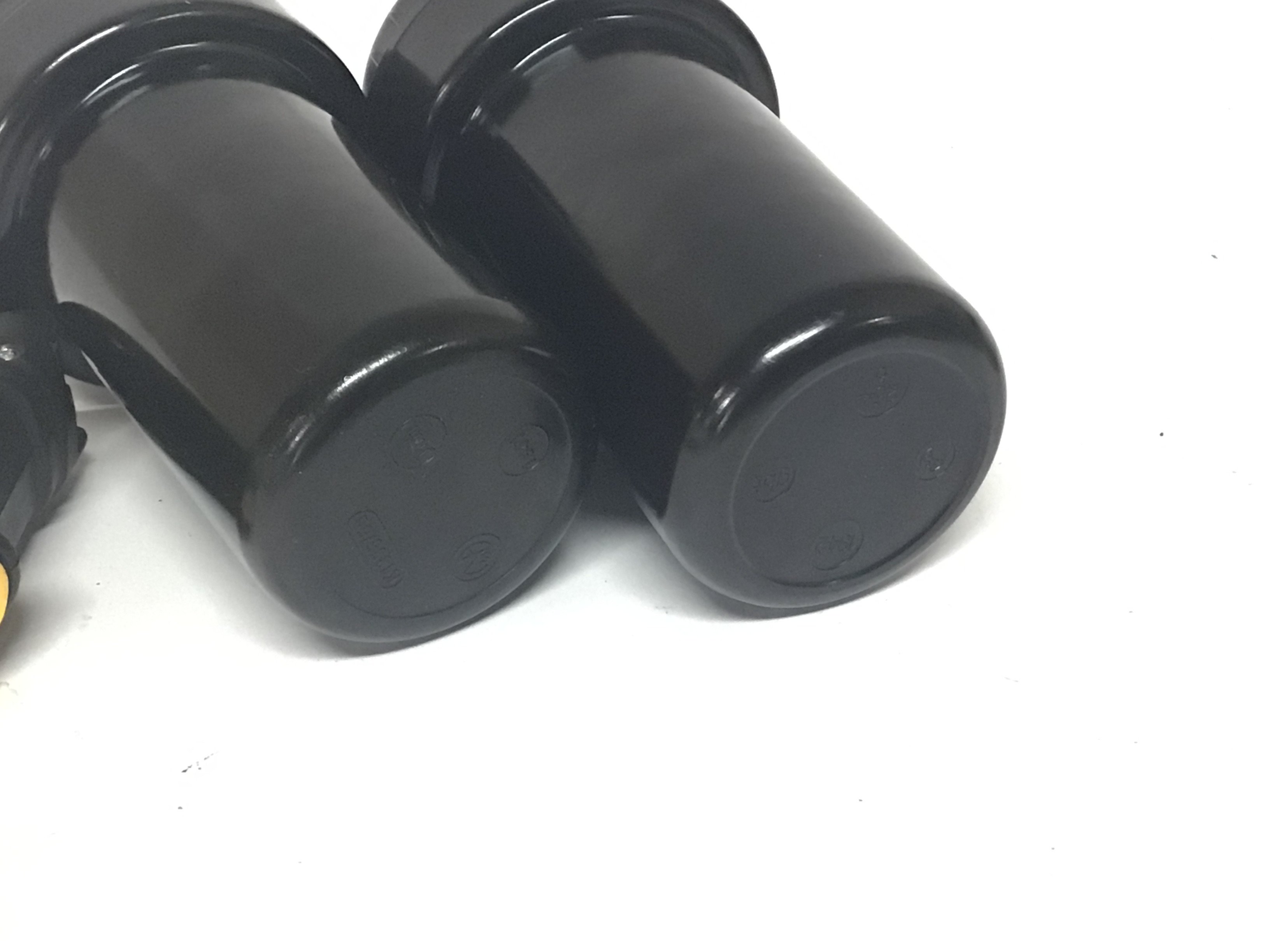 Two German II world war Military Bakelite fuse storage containers screw top and marked L2 with further marks including date 1942. Hight 13cm.- NO RESERVE