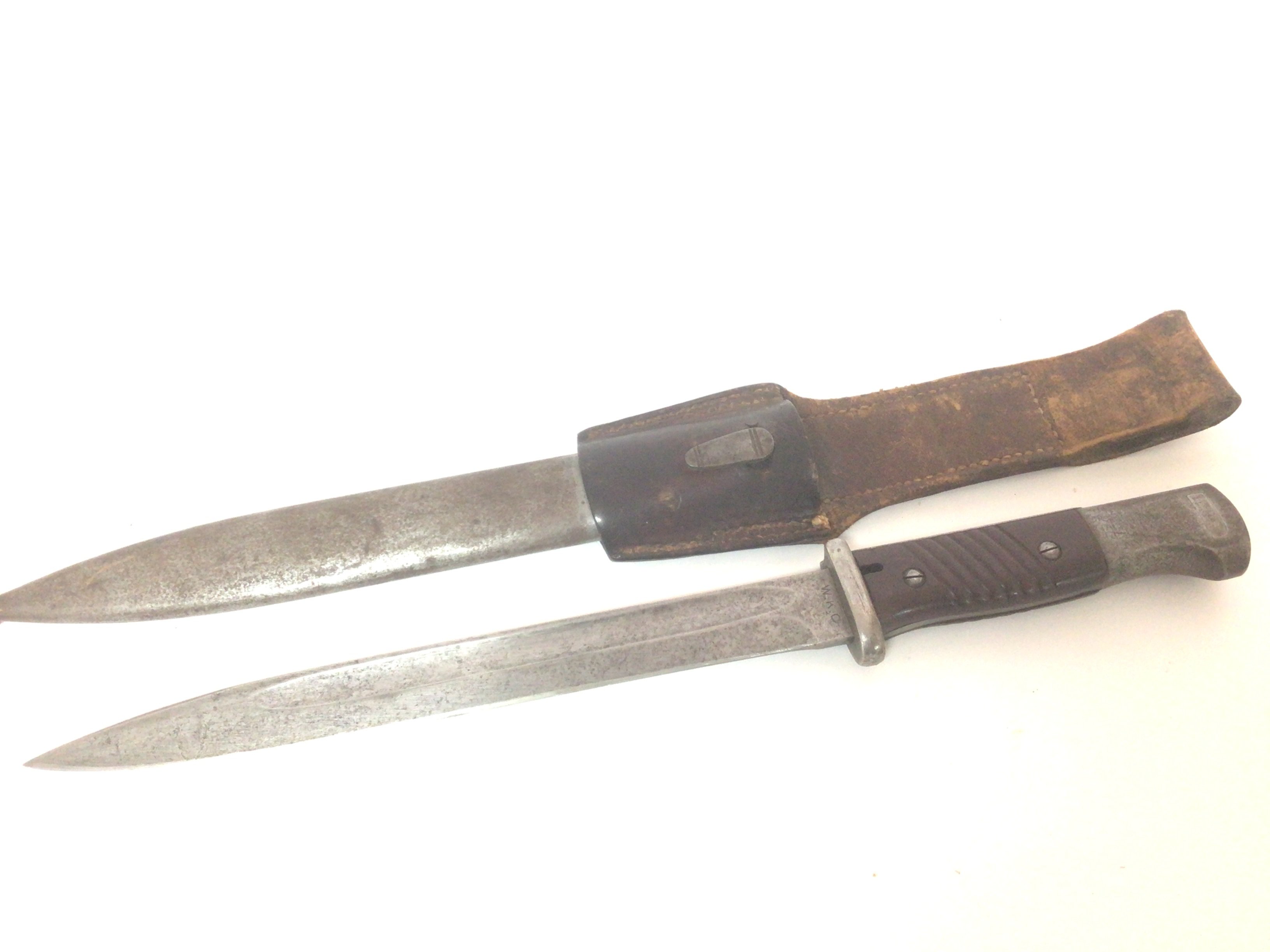 A German K98 Mauser II world war Bayonet maker WKC with original leather frog attachment.