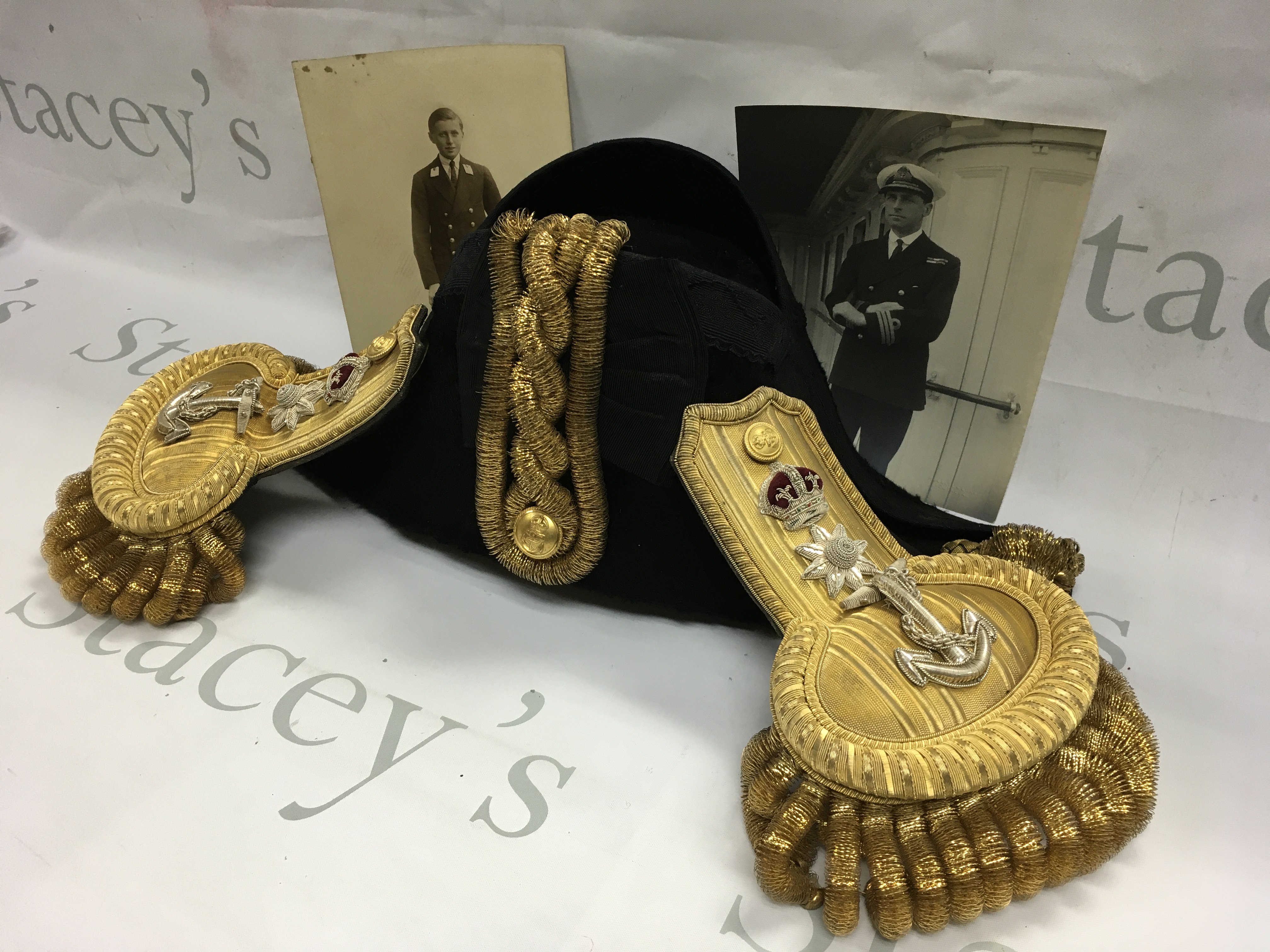 Auction 16th of April - The personal and comprehensive collection of Captain Rory Chambers O' Conor , including his father's K.B.E , O.B.E . R.N 1898 - 1941 . A unique collation of Royal Navy History including medals Navel corespondents telegrams Photographs and Private letters together with a Bicorn hat and Epaulettes in original box , collated between 1911 and 1941 . To include his cased K.B.E , O.B. E and WW1 group - ephemera - H.M.S Hood notes Letters from H.M.S Neptune 1940-1941, notes of praise for his book Ten Commandments, Confidential report annual bombardment report and Admiralty charts . Rory was Born 23 September 1898 he joined the Navy in August 1914 he was trained as a gunnery Officer and served aboard H.M.S Resolution H.M.S Emerald and H.M.S Royal Sovereign He was also assigned to the gunnery school at H.M.S Portsmouth. He served as the Executive officer of H.M.S Hood from 1933 to 1936 . During his tenure Hood was known as a renowned sporting ship , his attention to each crewmen made O'Connor a highly Respected and beloved officer it was during this timeframe that he created his famous Ten Commandments for running a big ship . After leaving H.M.S . Hood , O'Conor attended the imperial Defence course . He was then assigned to the plans division of the Admiralty at H.M.S President he held this position until May 1940 when He took command of the cruiser H.M.S Neptune . Neptune sank after being damaged by mines off Libya in December 1941 O'Conor survived the sinking but died before he could be rescued the date is believed to have been 23rd December 1941 .