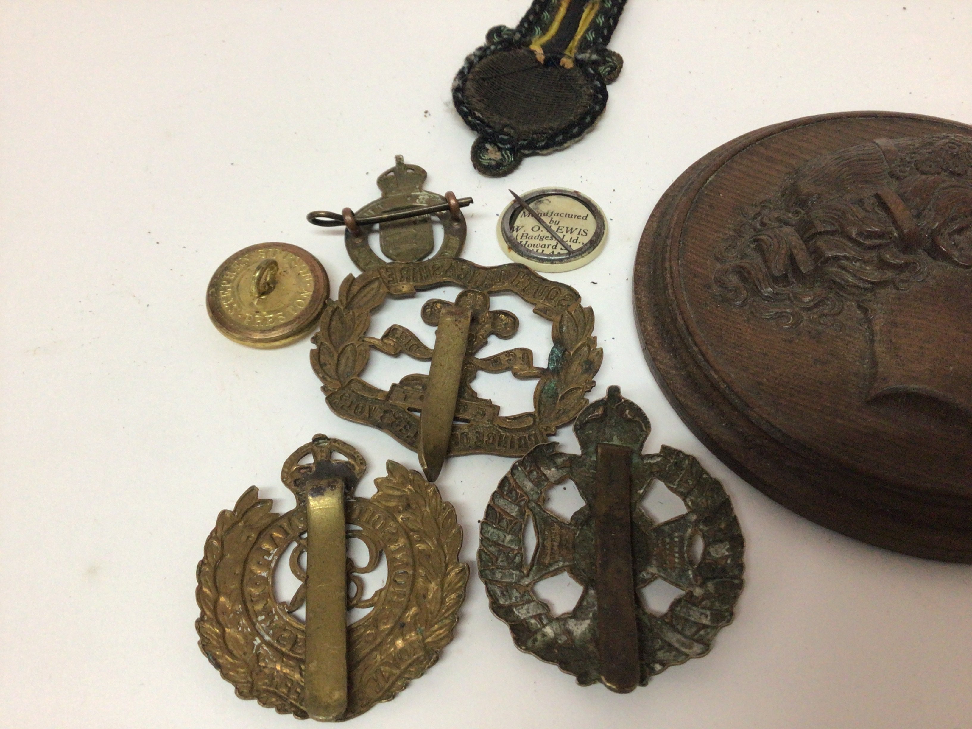 A Rifle Brigade Waterloo cross cap badge South Lancashire Egypt cap badge a Victorian carved wood neo classical plaque and other oddments.- NO RESERVE