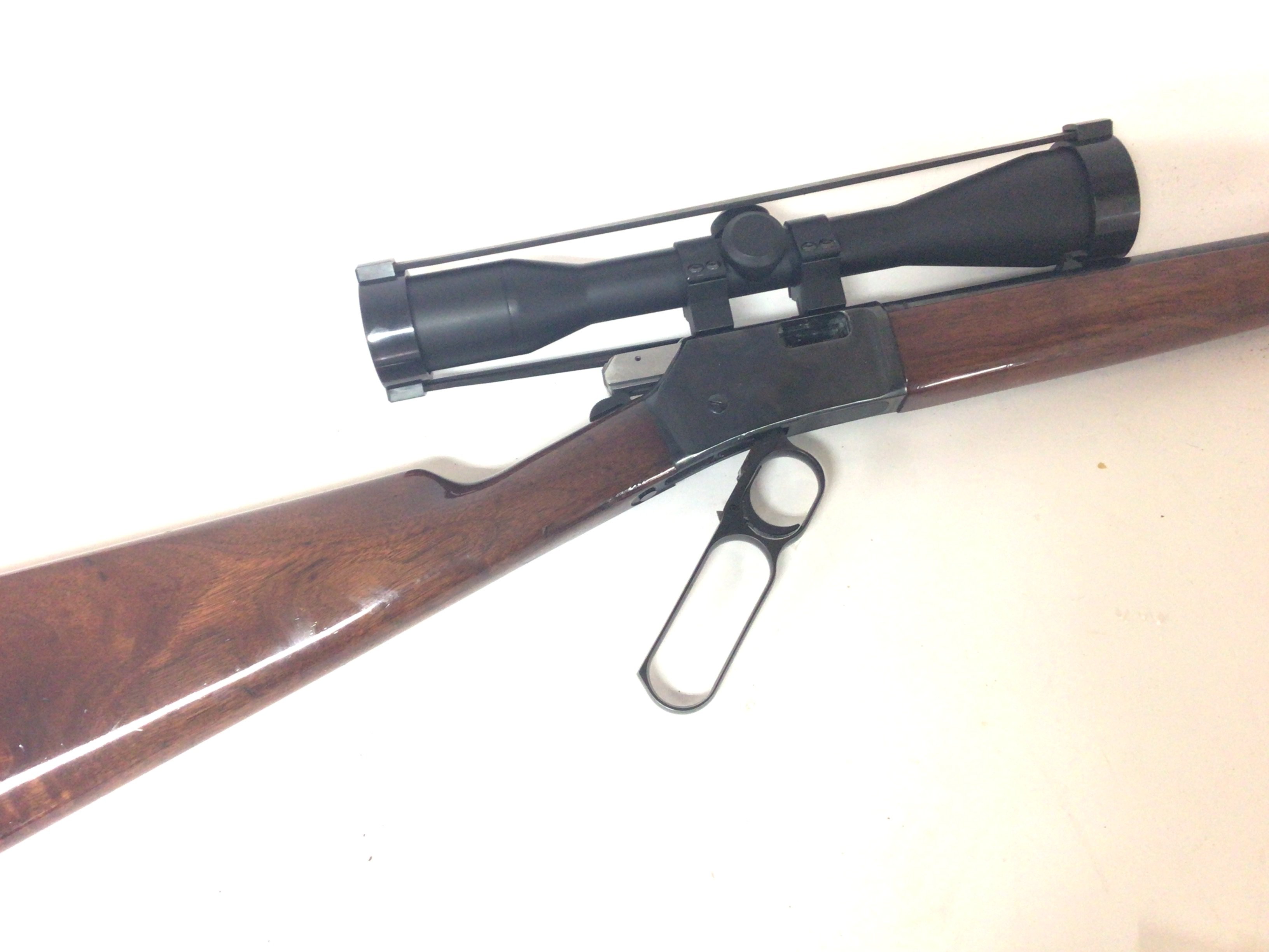 A Nice 22 Browning Rifle under leaver action three quarter walnut stock with an attached scope. The gun in very good condition an ideal entry level target rifle or ideal Rabbit and small game gun serial number 69B14698. Total length 92cm A FIRE ARMS LICENSE IS REQUIRED TO BID AND BUY THIS LOT.VIEWING AND COLLECTION BY APPOINTMENT ONLY.