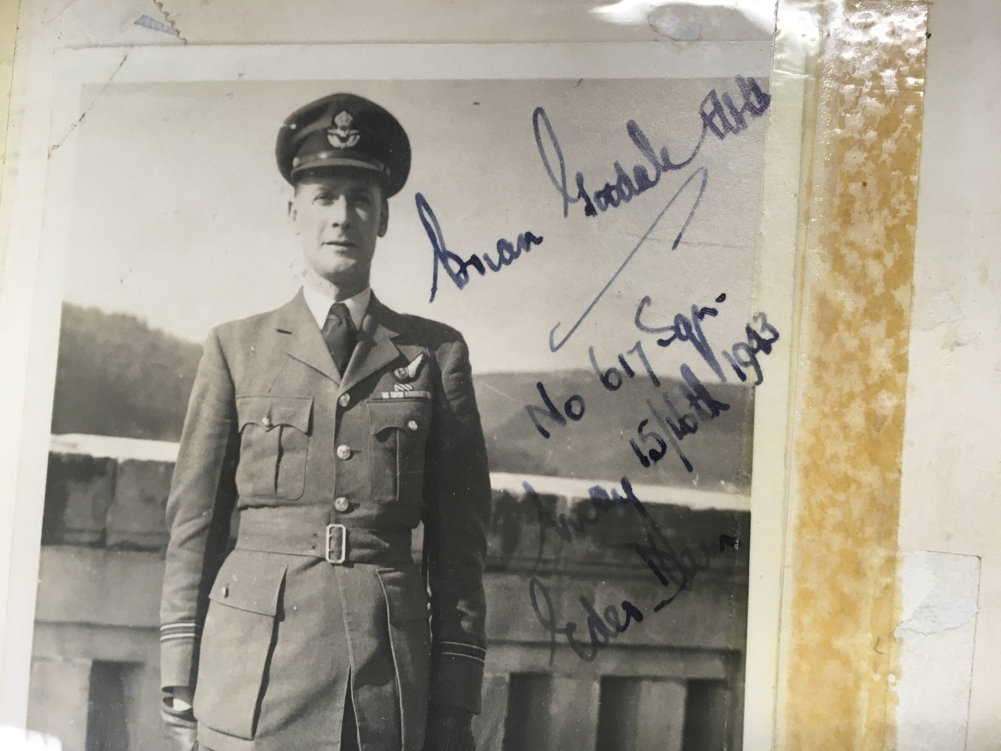 A signed photo of Brian Goodale and a copy of the Dam busters book. Postage B