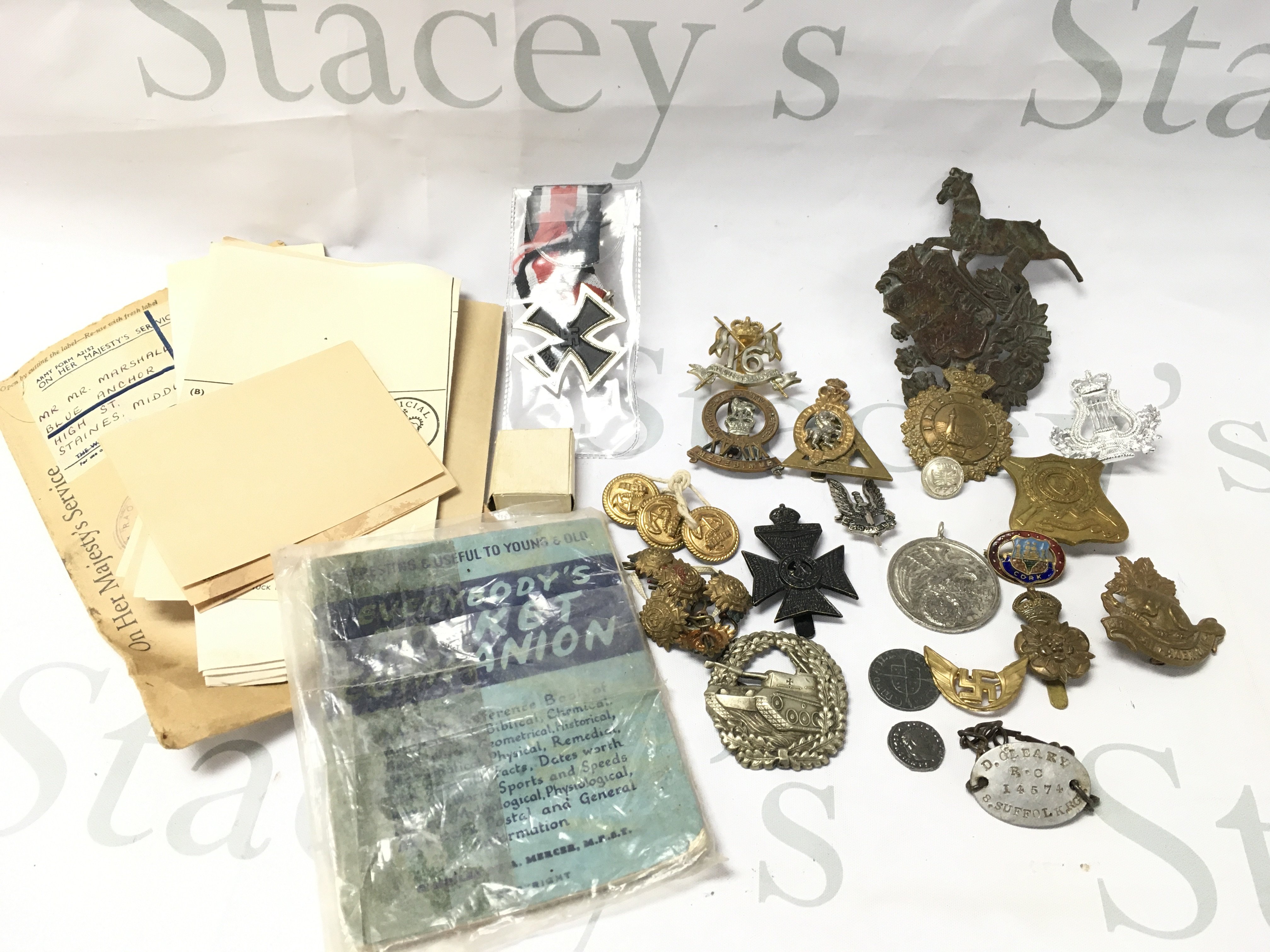 A Collection of Military Cap Badges.Buttons. A Dog Tag. Etc. Some Are Replicas. No Reserve.