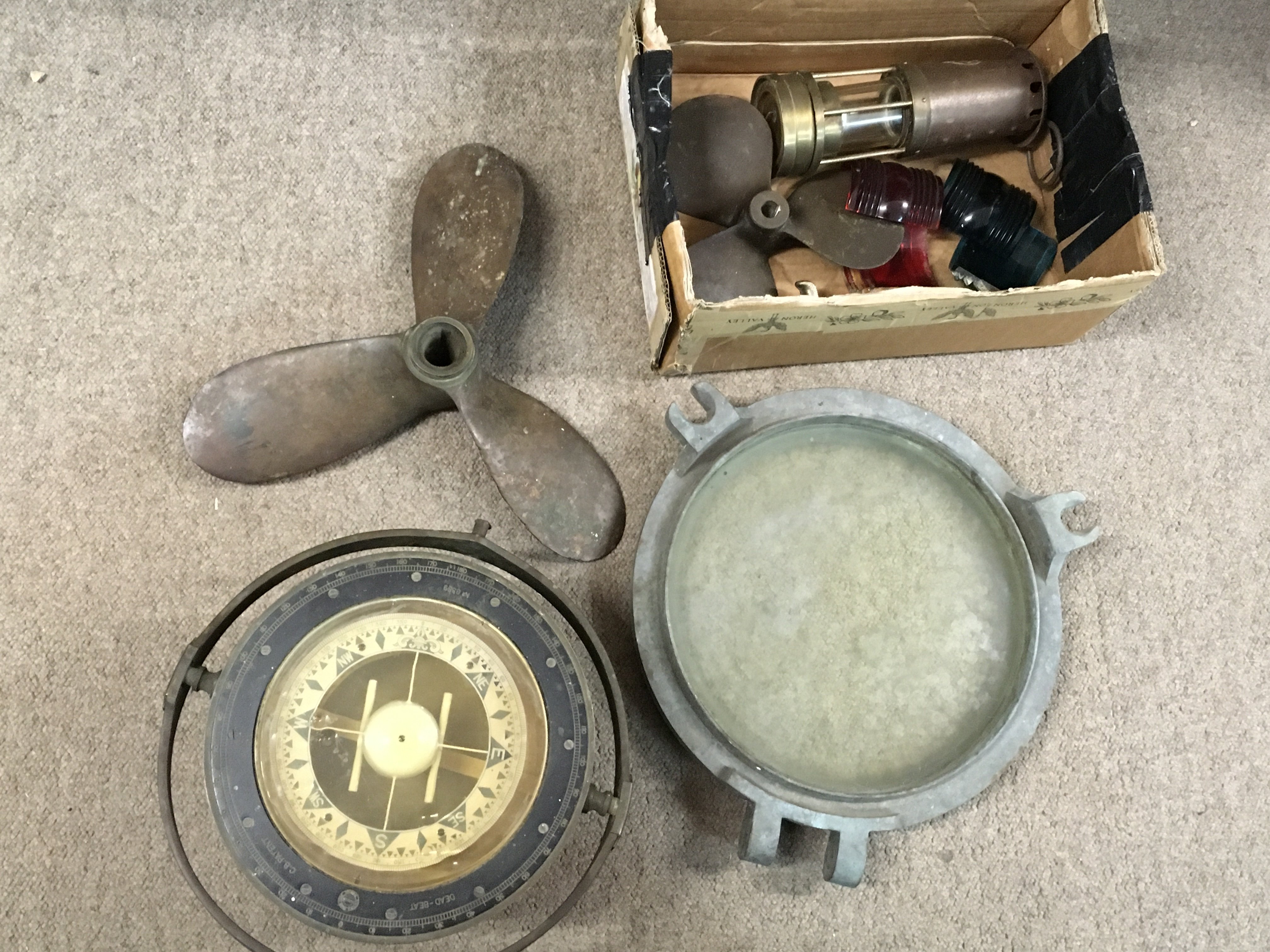 Vintage ship items including a divers knife, propellers , ships compass and a E. Thomas & Williams brass miners lamp