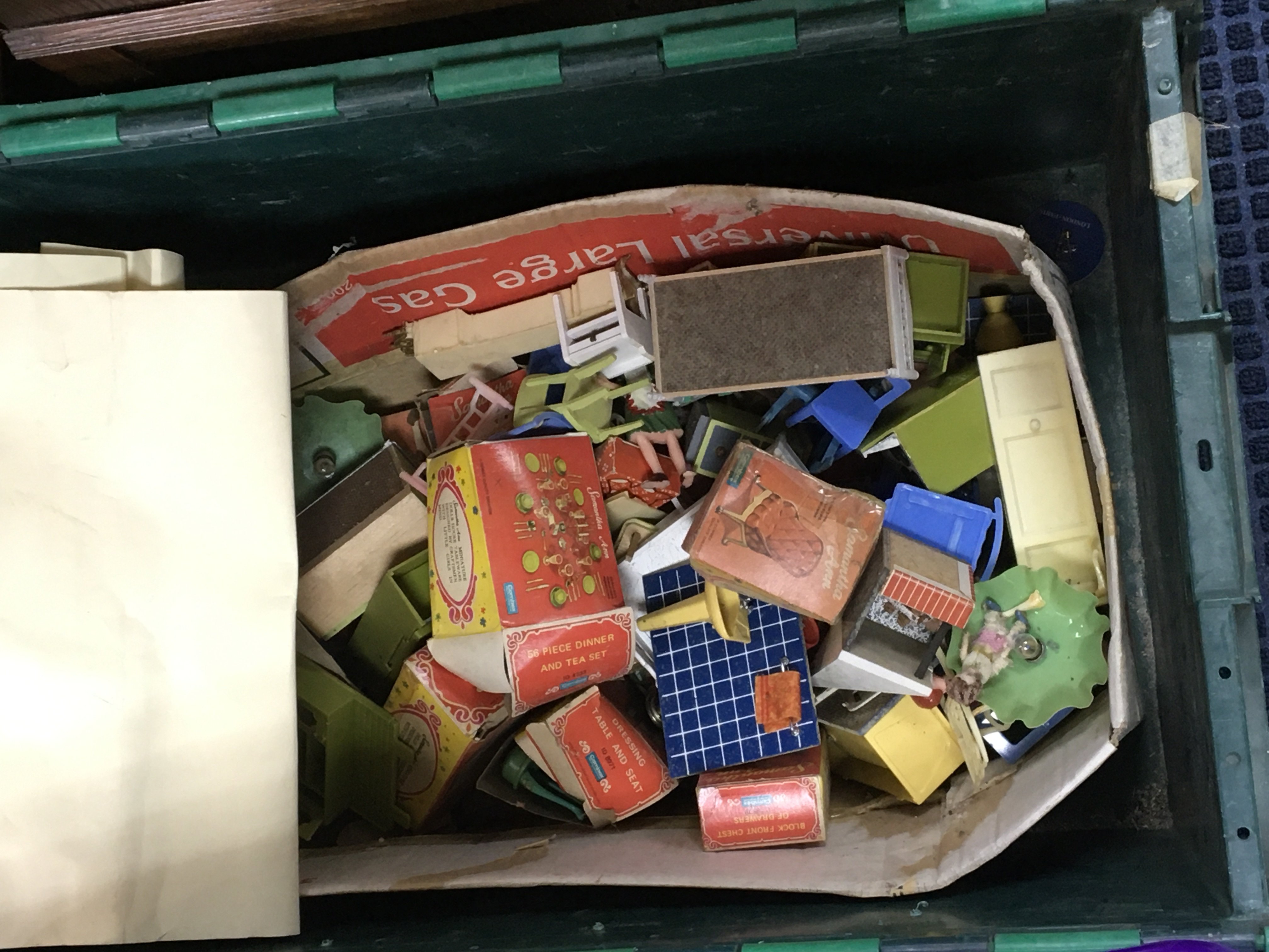 A box containing playworn die cast vintage toys and a quantity of dolls house furniture and other items. NO RESERVE