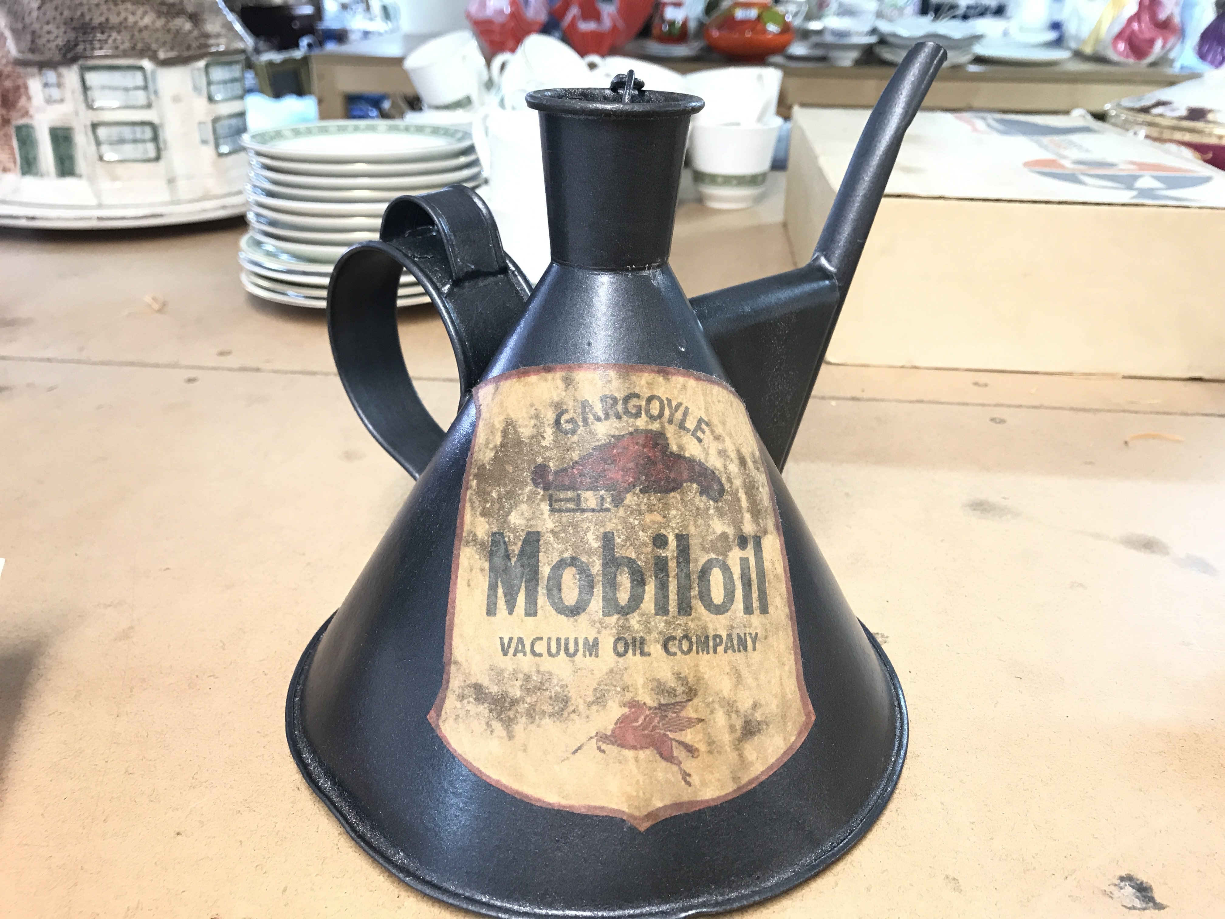 A vintage unusual shaped oil can possibly used to add oil to the pistons in the S.U carbs Mobil oil label . 18cm tall postage cat B