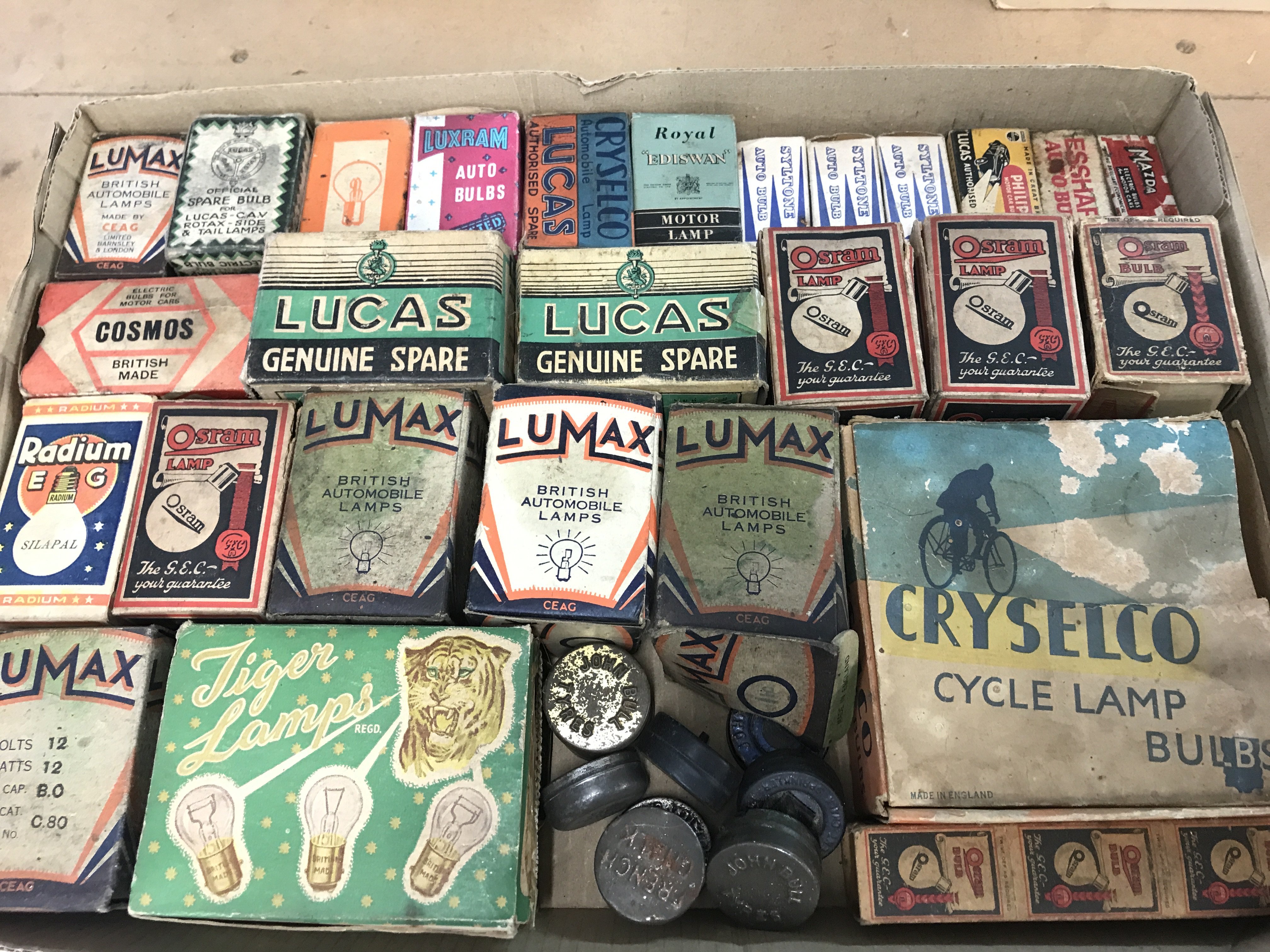 A collection of vintage light bulbs in original boxes