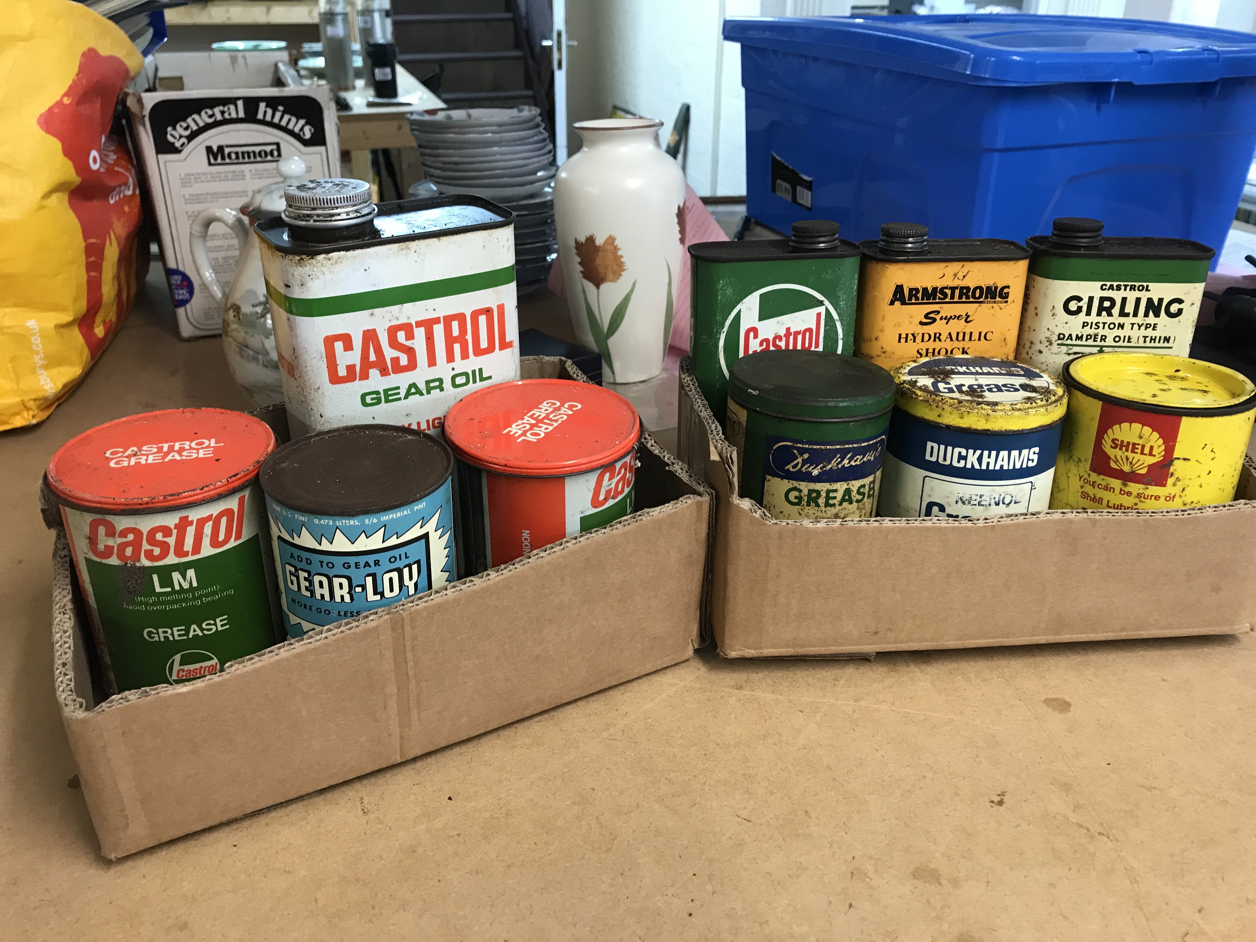 A Collection of vintage motoring grease tins including Duckhams , Shell, Castrol etc. postage category B