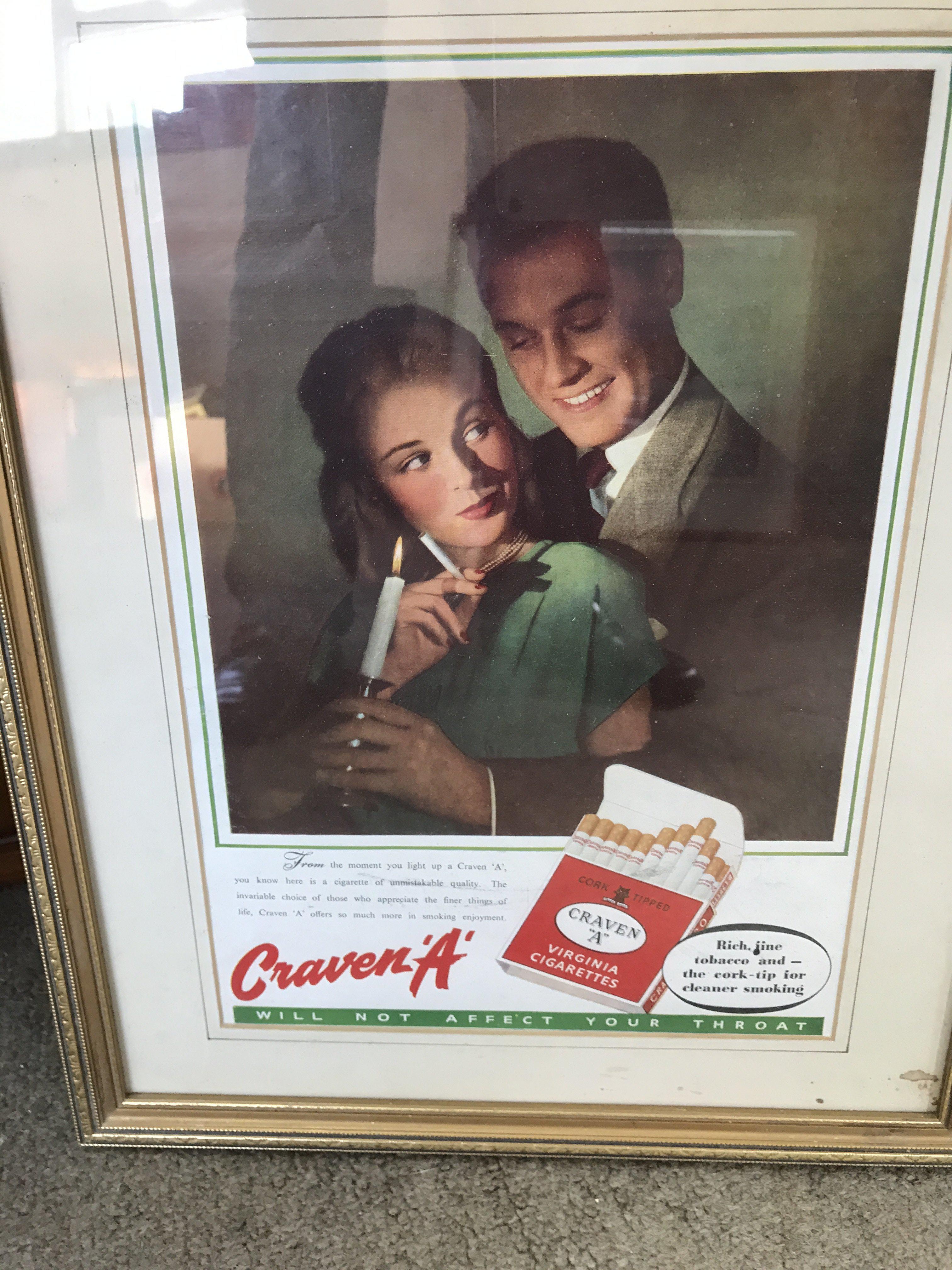 Four framed advertisement pictures.