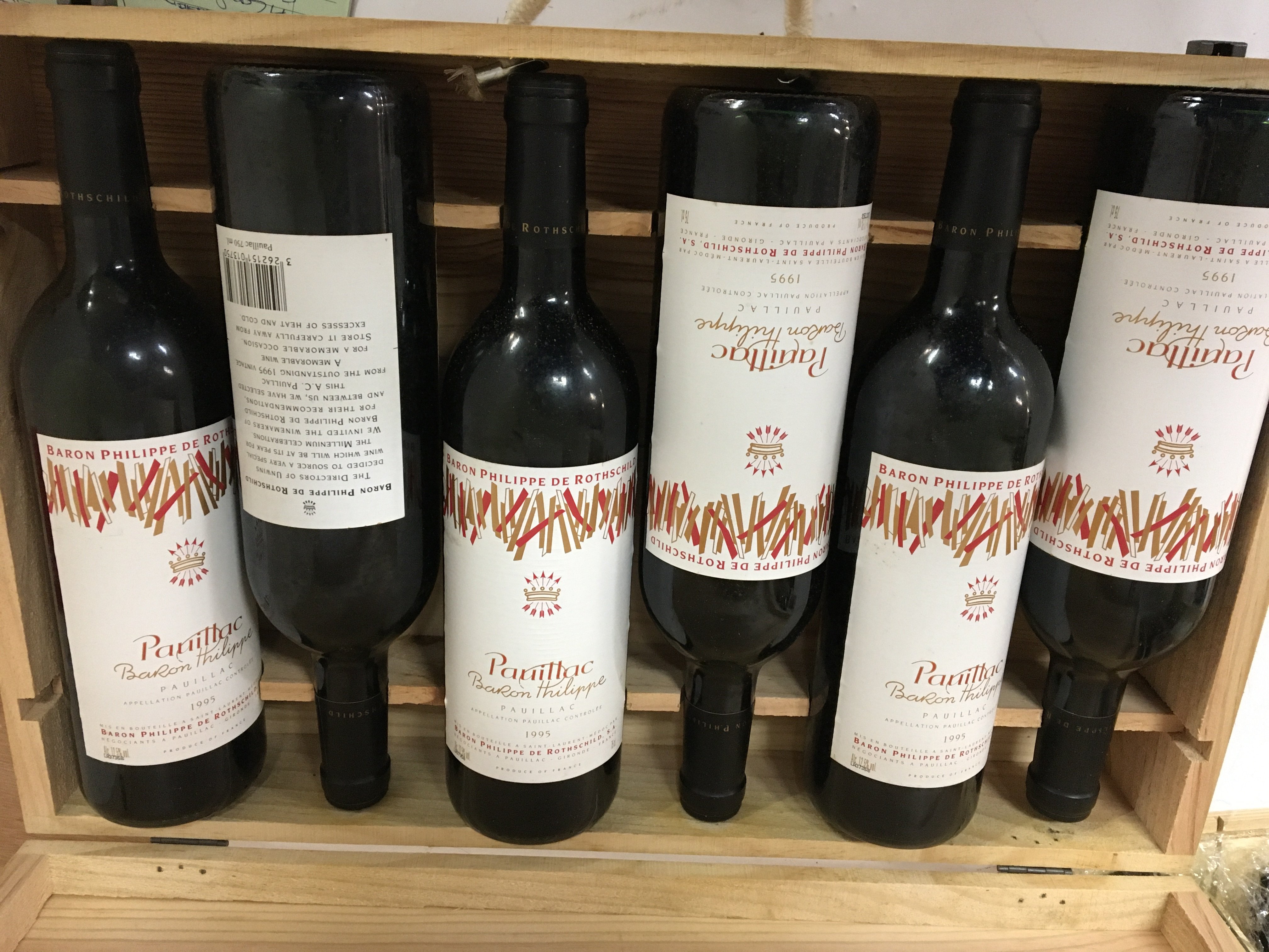 A case containing six bottles of Baron Philippe De Rothschild 1995 Pauillac and case containing three bottles of Spanish 1996 Rioja