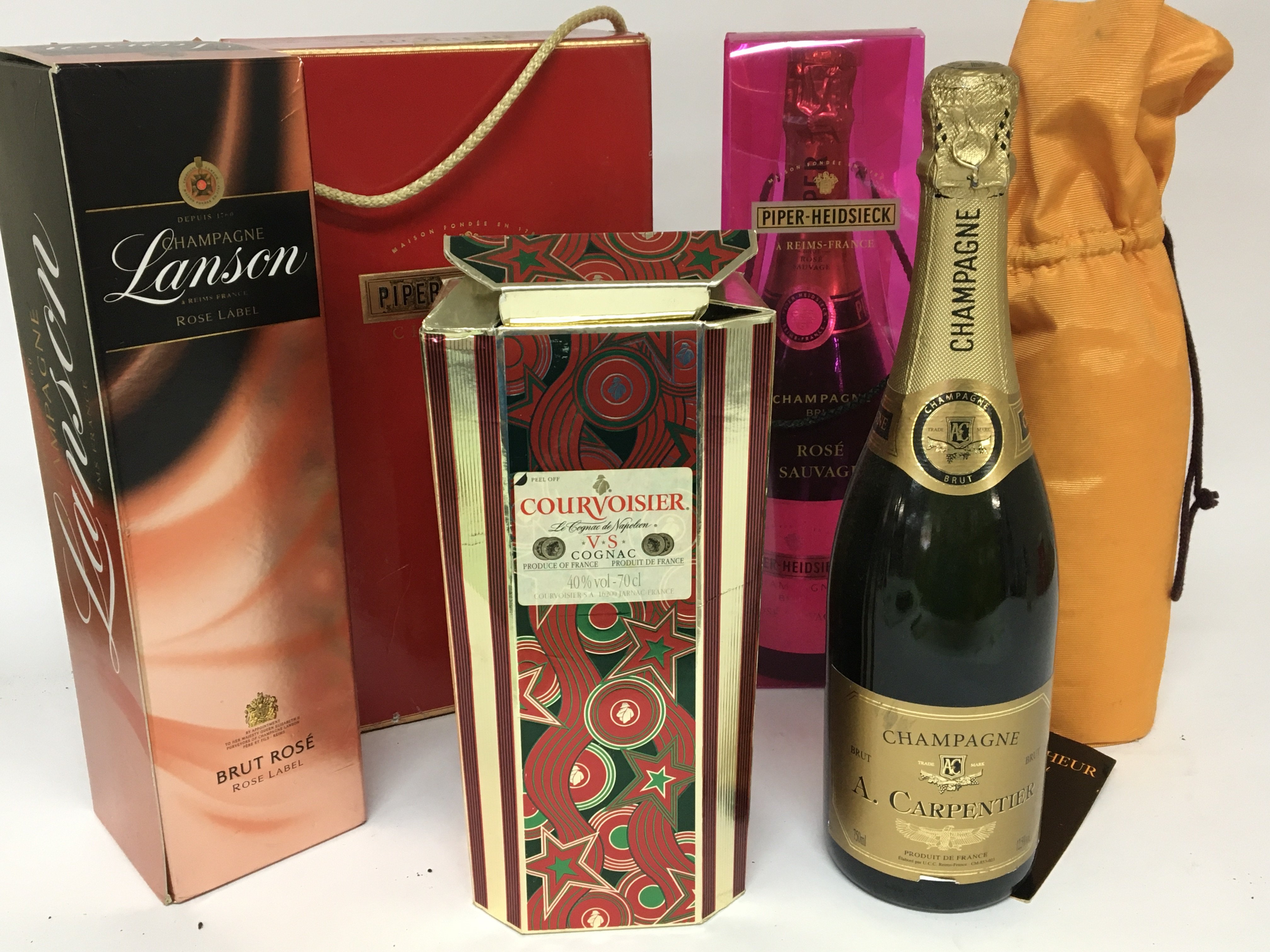 A collection of Champagne Piper Heidsiek Lanson and others. A bottle of Courvoisier VS Cognac.