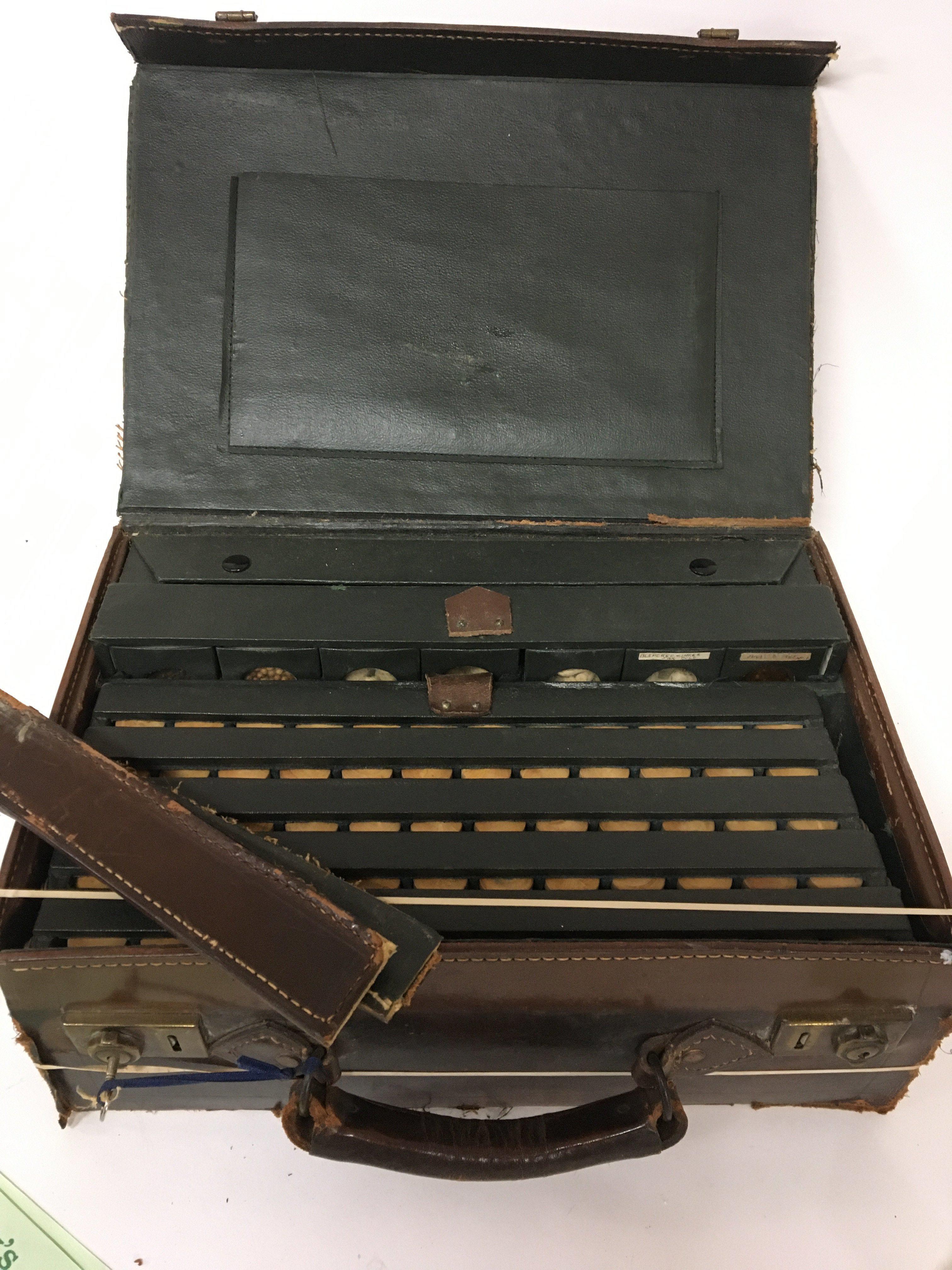 An unusual Specimen Spice case the leather case with a well fitted interior containing numerous spice samples case in need of restoration.