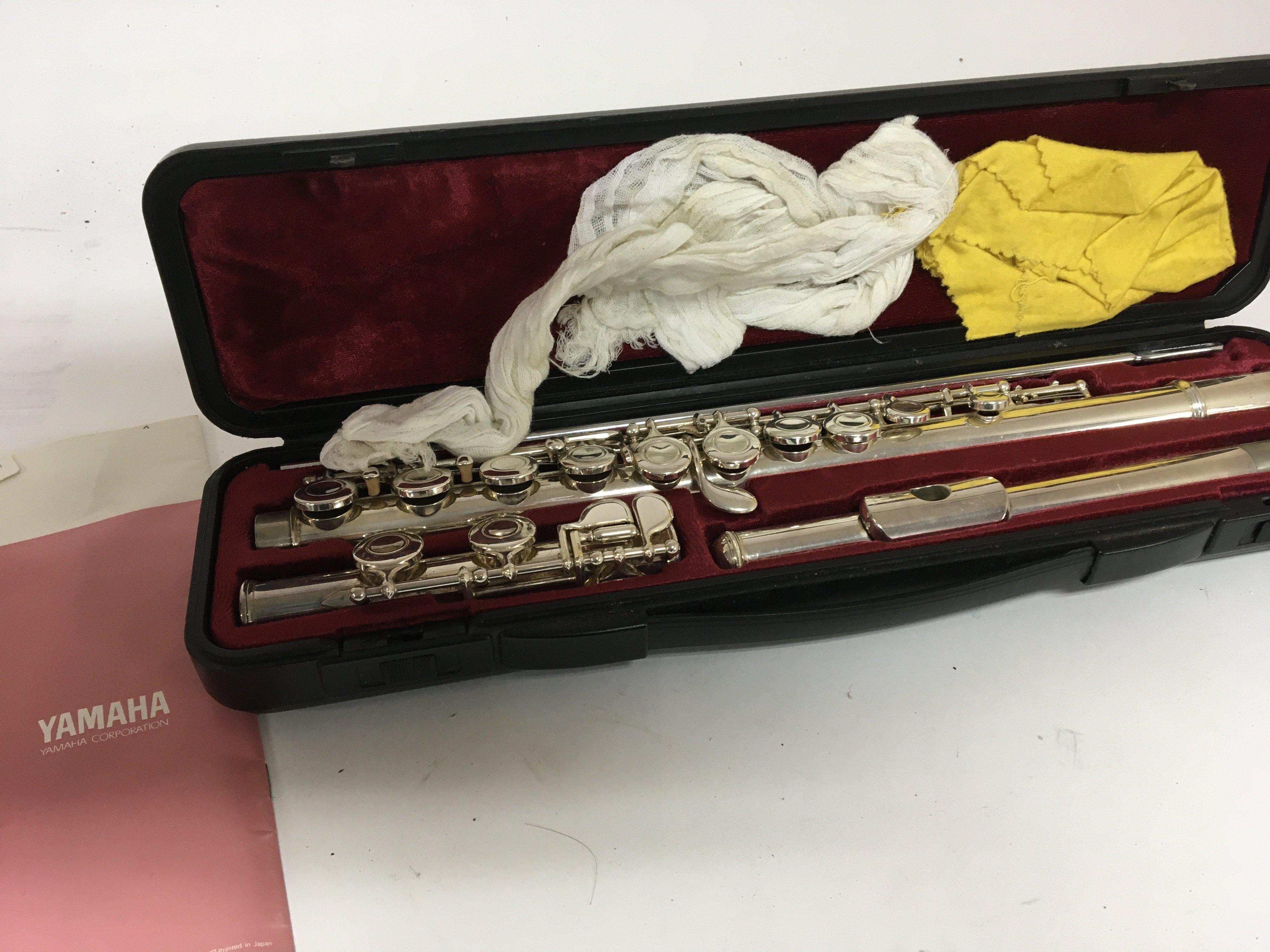 A Yamaha chrome finish flute in a fitted case good condition.