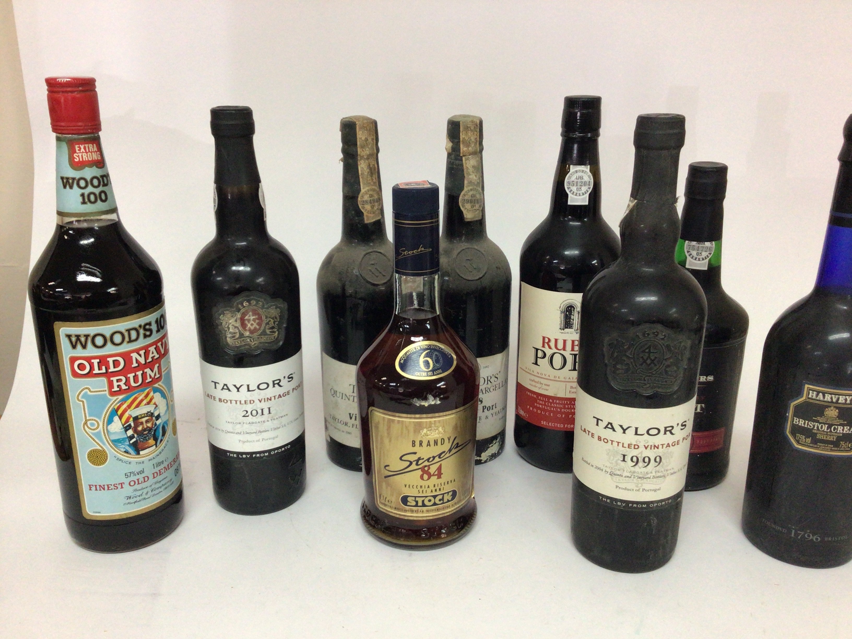 A collection of Ports two bottles of Taylor&#2013266057۪s 1978 one 1999 one 2011and other bottles Port Rum Brandy.