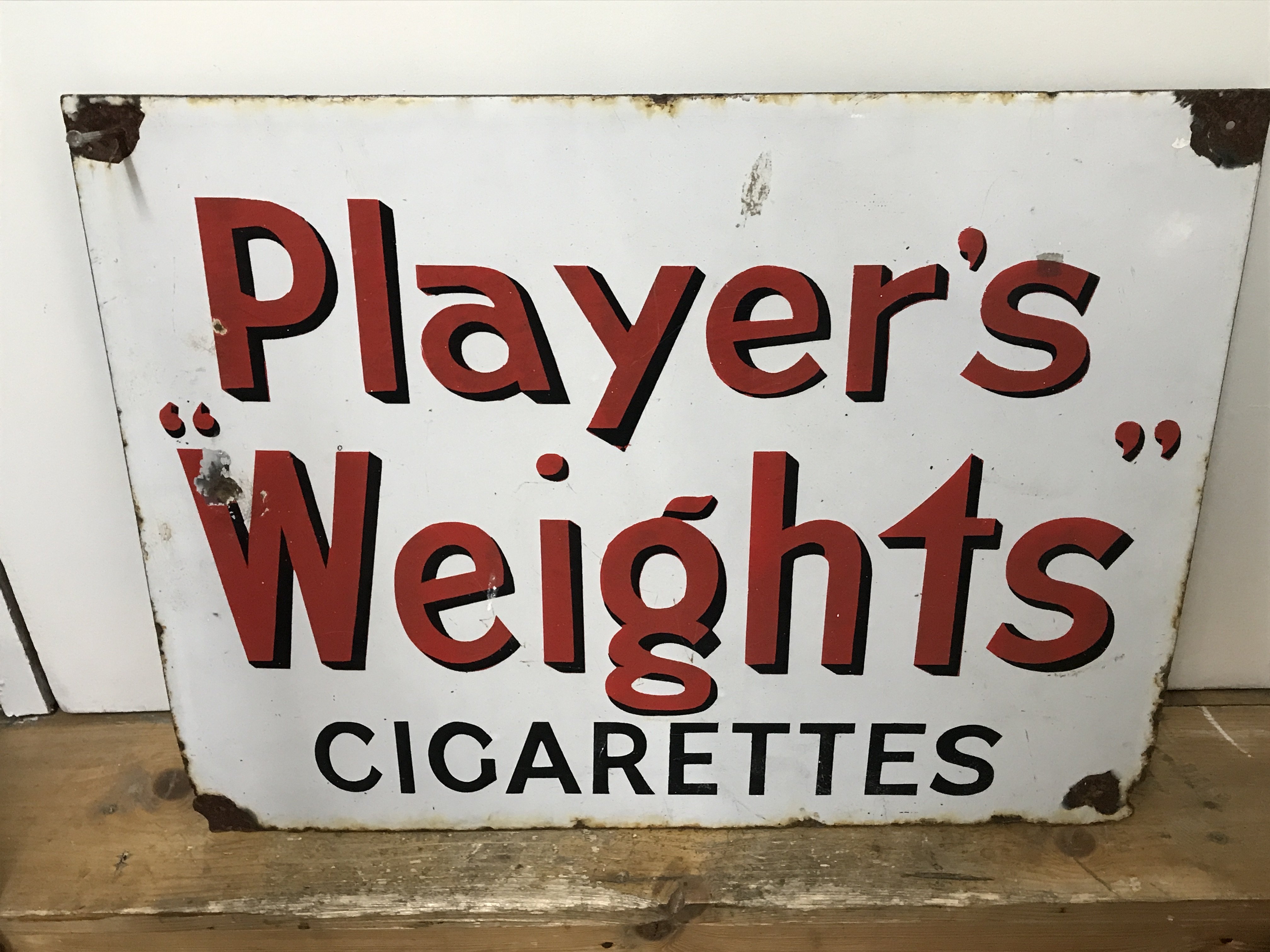 A vintage Players Weights cigarettes enamel advertising sign, dimensions 55cm long 42 cm tall