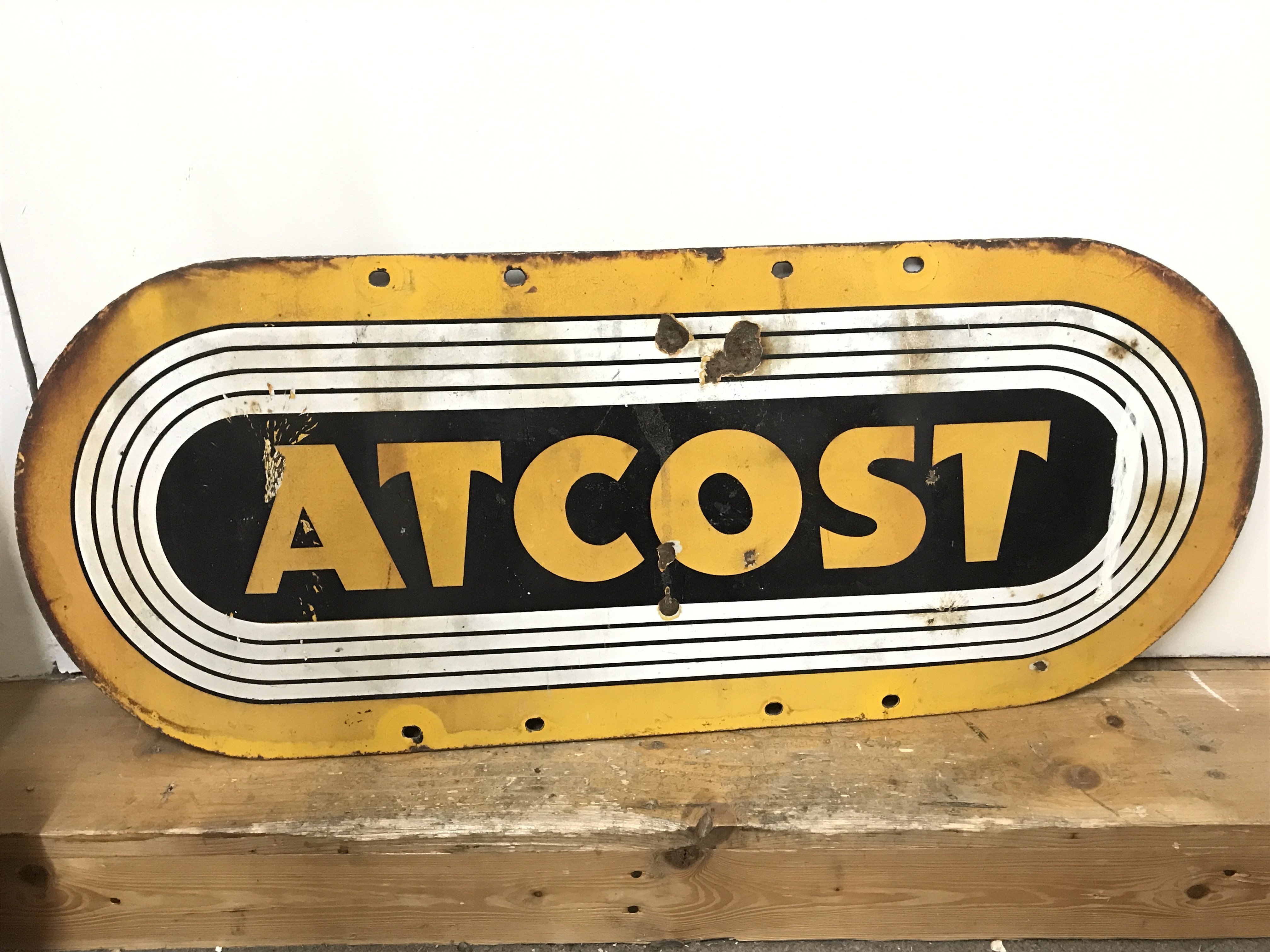 A vintage Atcost farm building enamel sign , 76cm long, 30cm tall