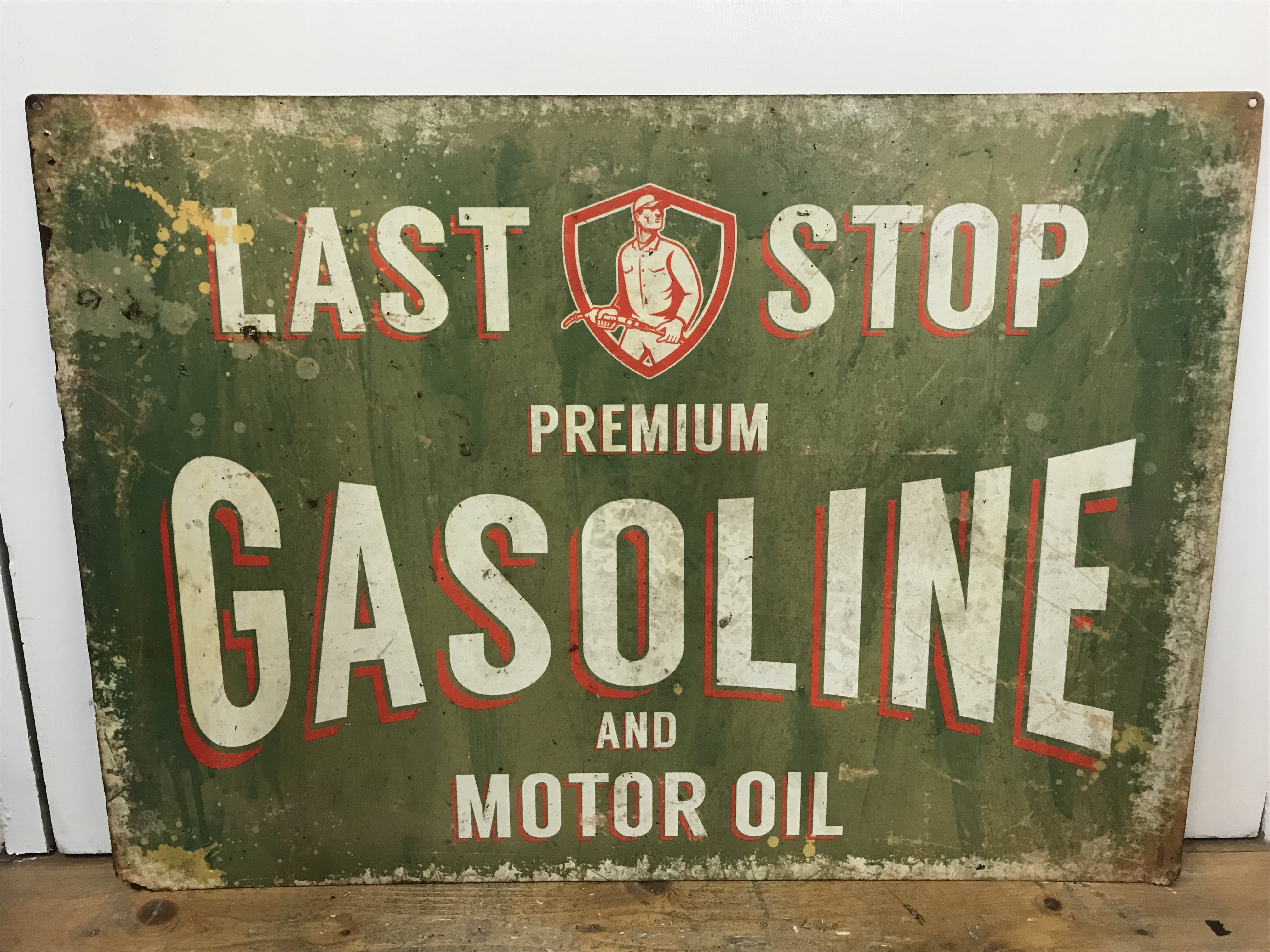 A vintage Last Stop Premium gasoline and motor oil enamel sign , 70cm wide 50cm tall