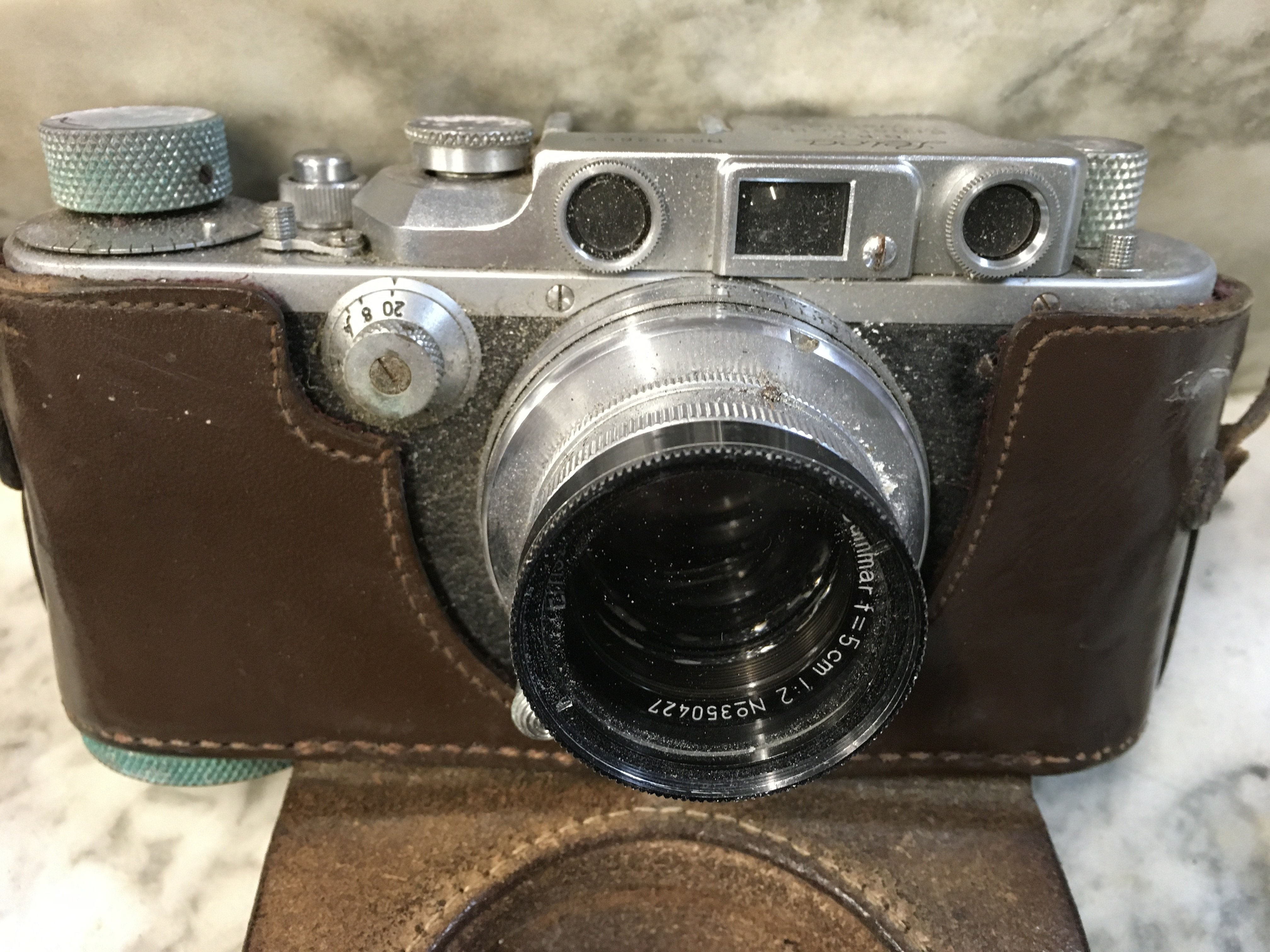 A Leica camera D.R .P No 282657 Summar lens 1.2 No 350427 .fitted in a leather case .