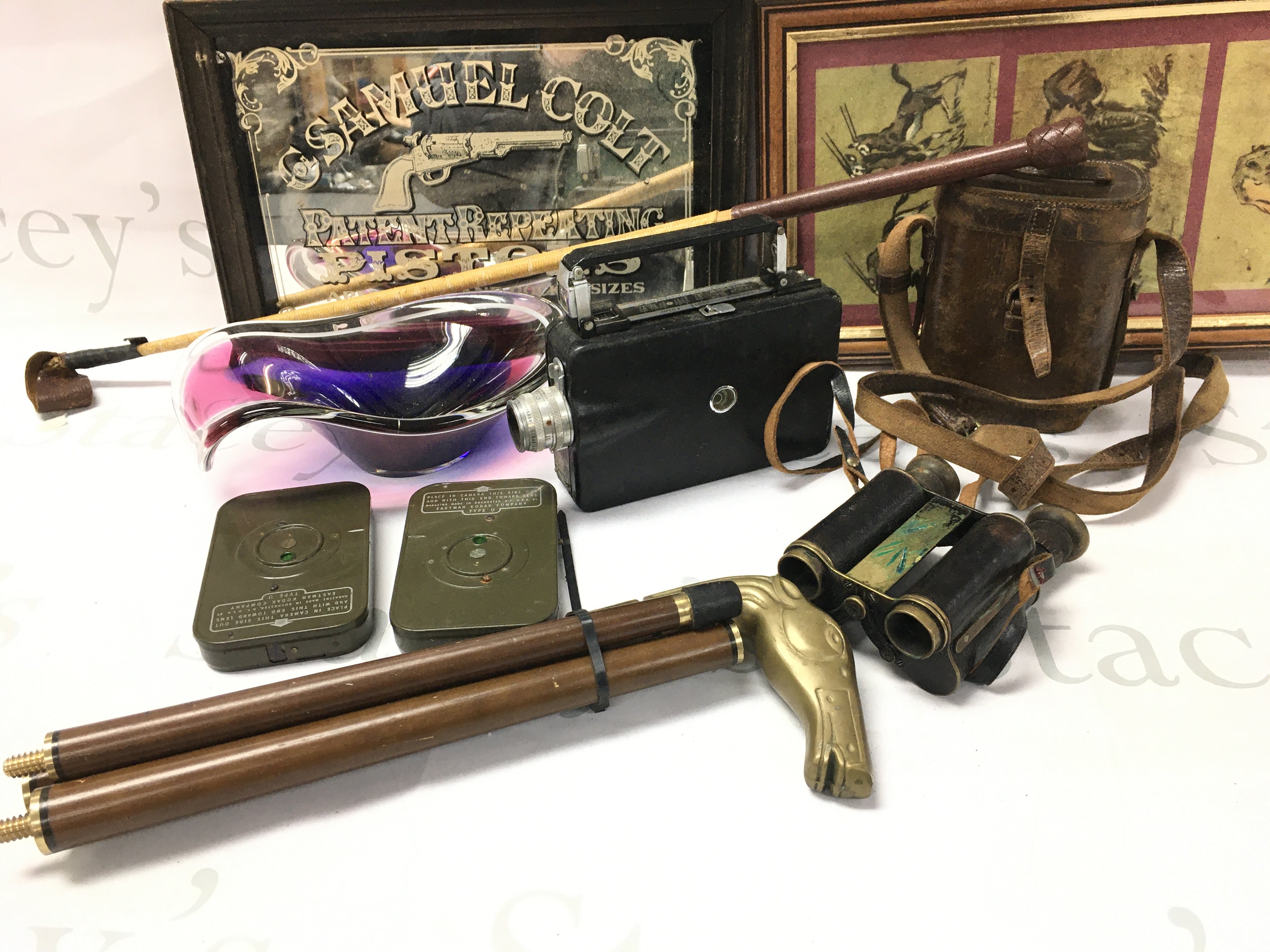 WITHDRAWN - A Collection of Oddments Including a Riding Crop. A Vintage Kodak Camera with 2 Cartridges. A G. Samuel Colt Mirror. A Horse Topped Walking Stick With A Hidden Drinks Vessel. Etc.