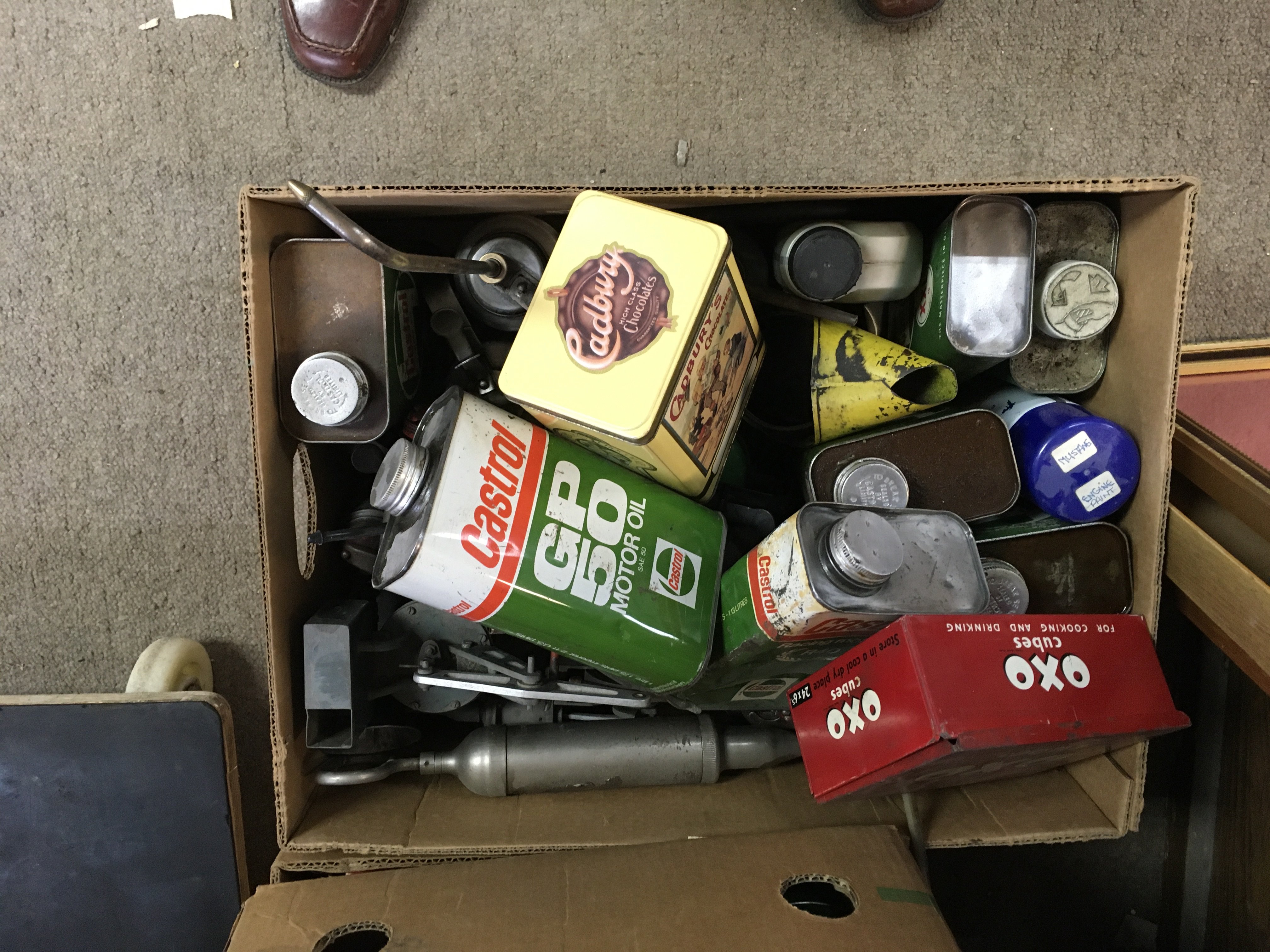 Three boxes containing tins oil cans valves various.