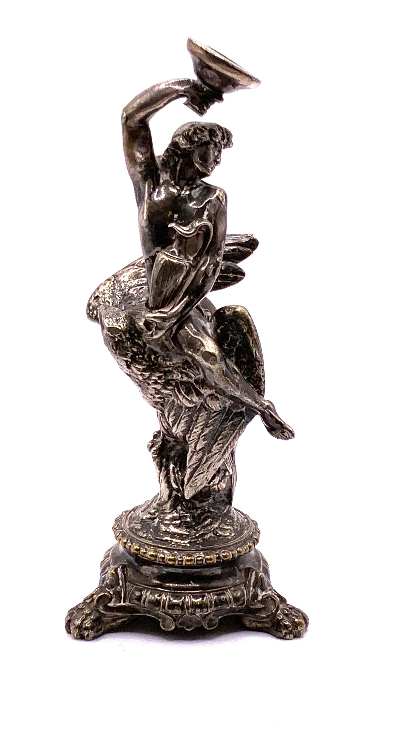 A Late Victorian silver plated figure in the form of Ganymede seated upon an eagle holing a cup and an amphora, dated 1851. 14.5cm. Possibly Henry Wilkinson. (B)