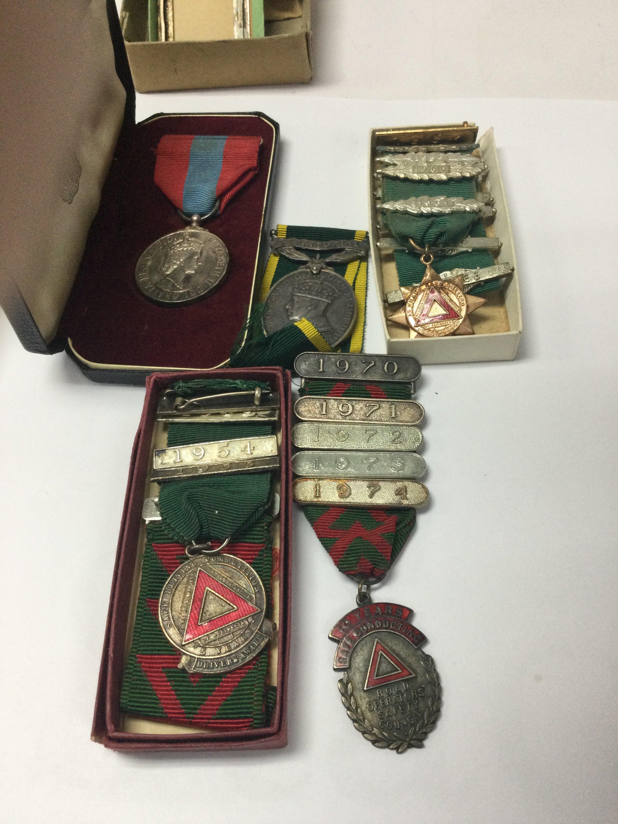 A collection of bus medals and a imperial medal.