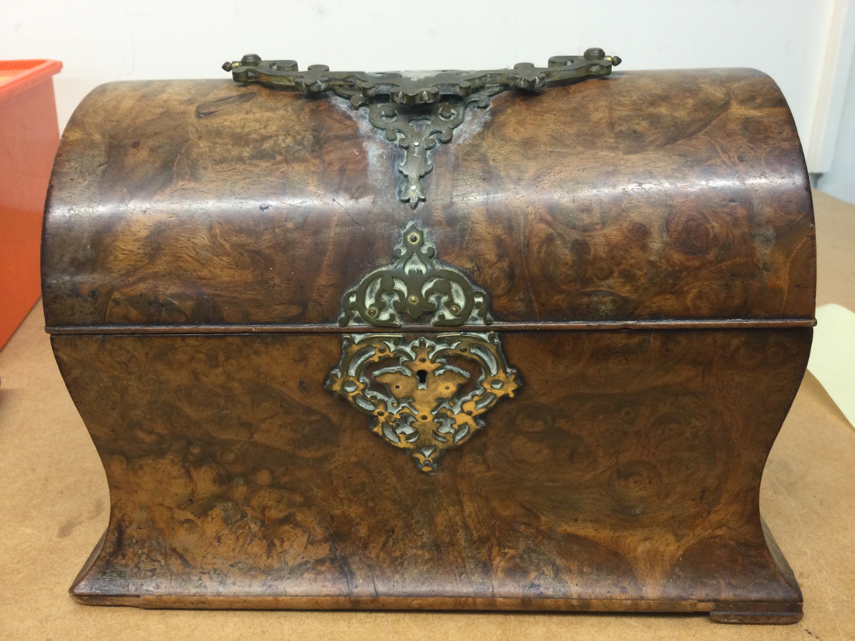 A Victorian walnut stationary box the hinged lid enclosing a fitted interior.