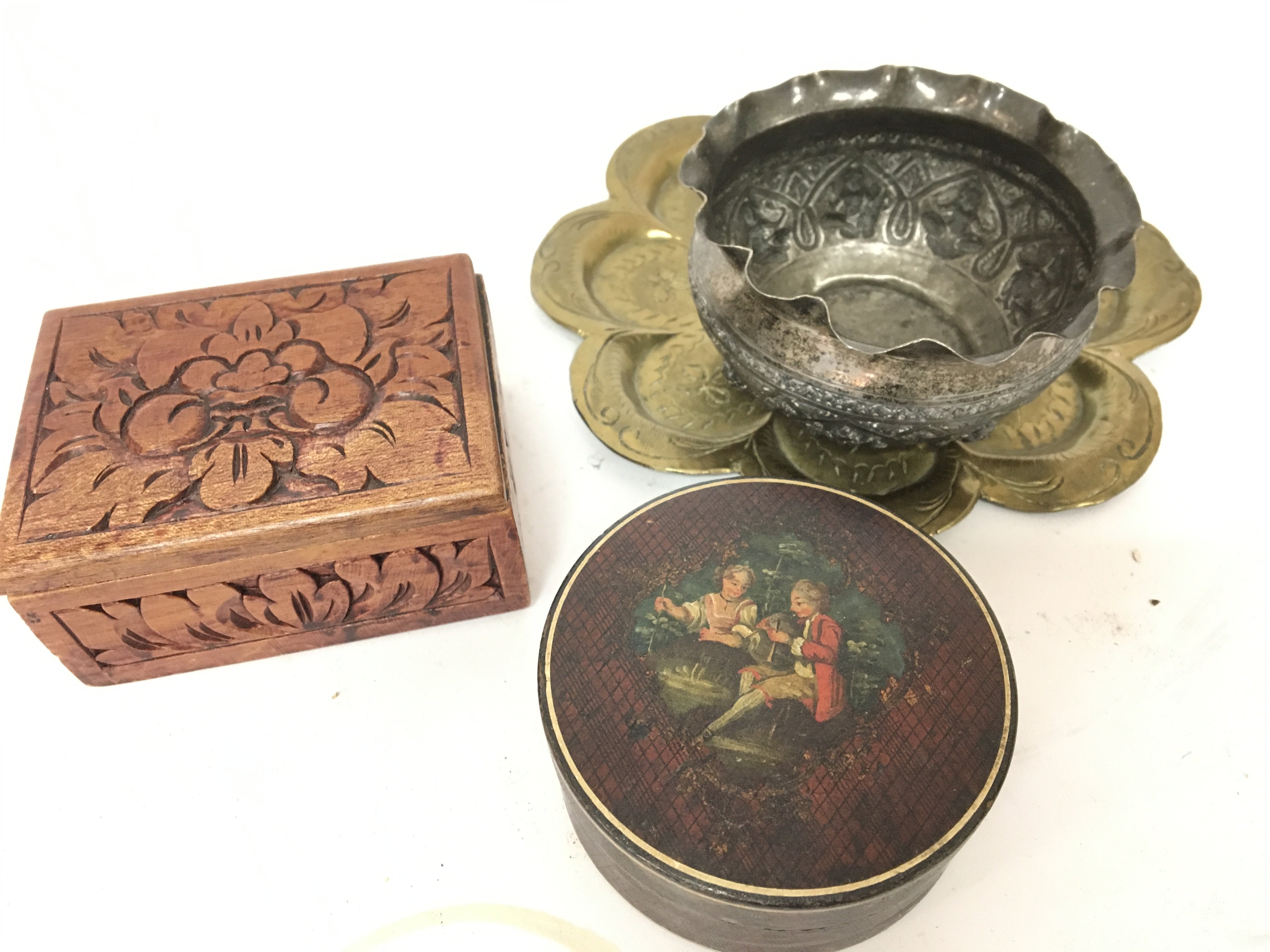 An Indian white metal bowl small brass tray a painted and lacquer box and one other. (4)