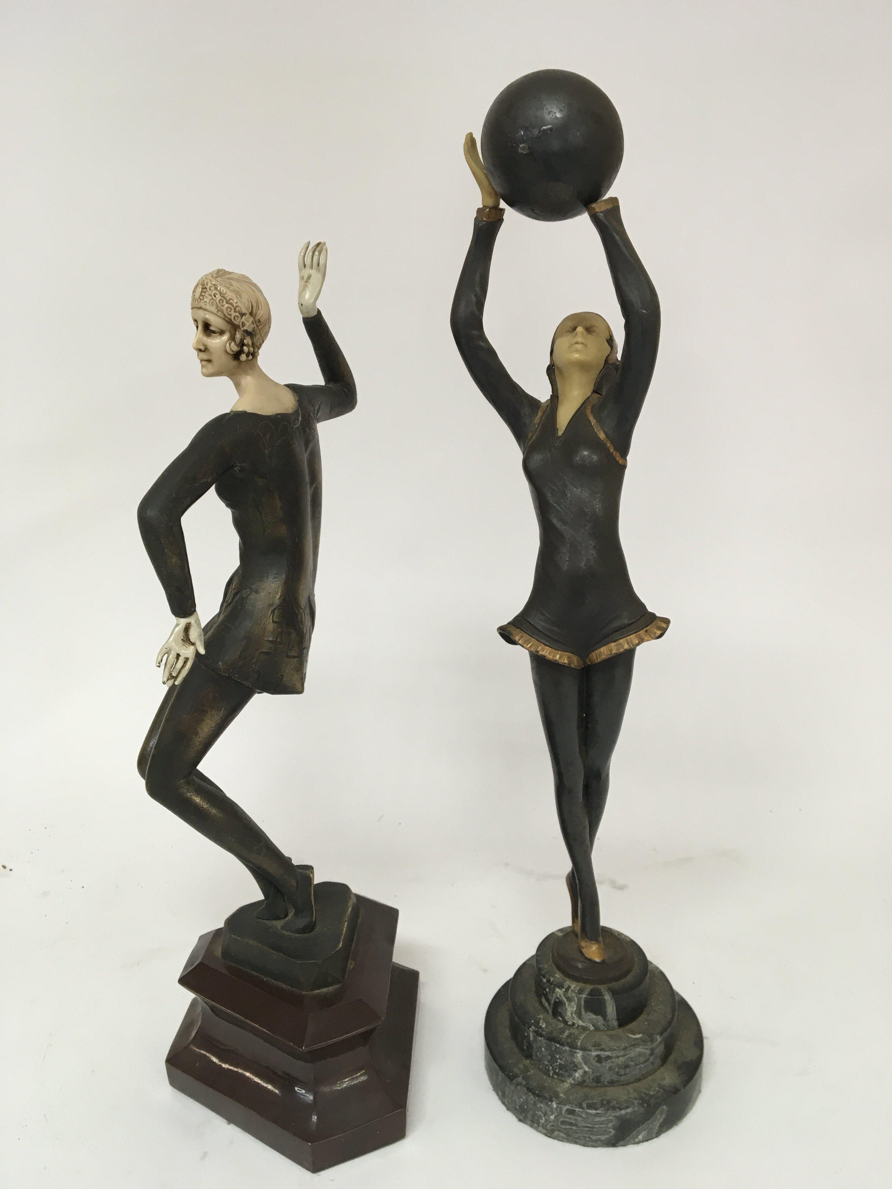 Two Art Deco Style bronze and composition dancing figures on marble bases (2)