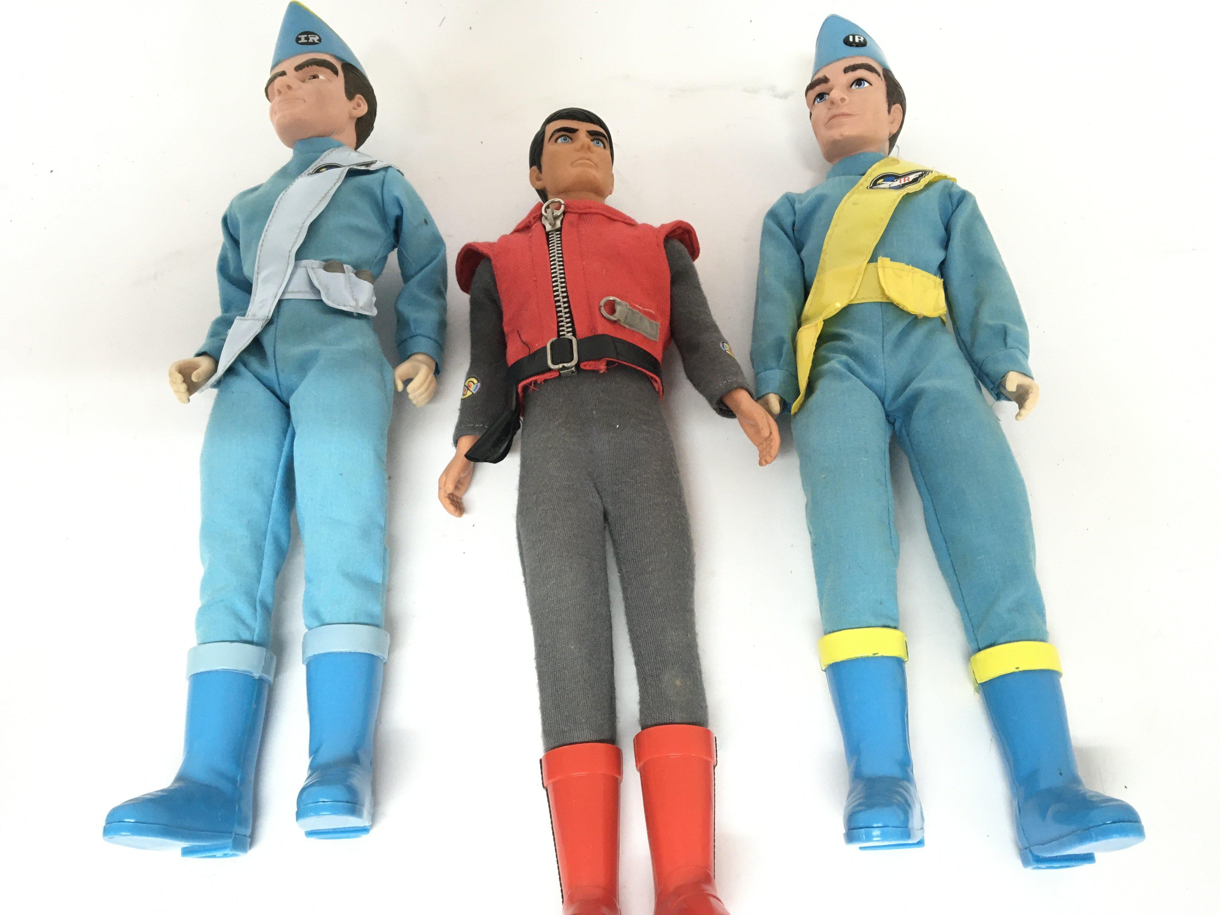 Three Vintage dolls two Thunderbird figures and one other (3)