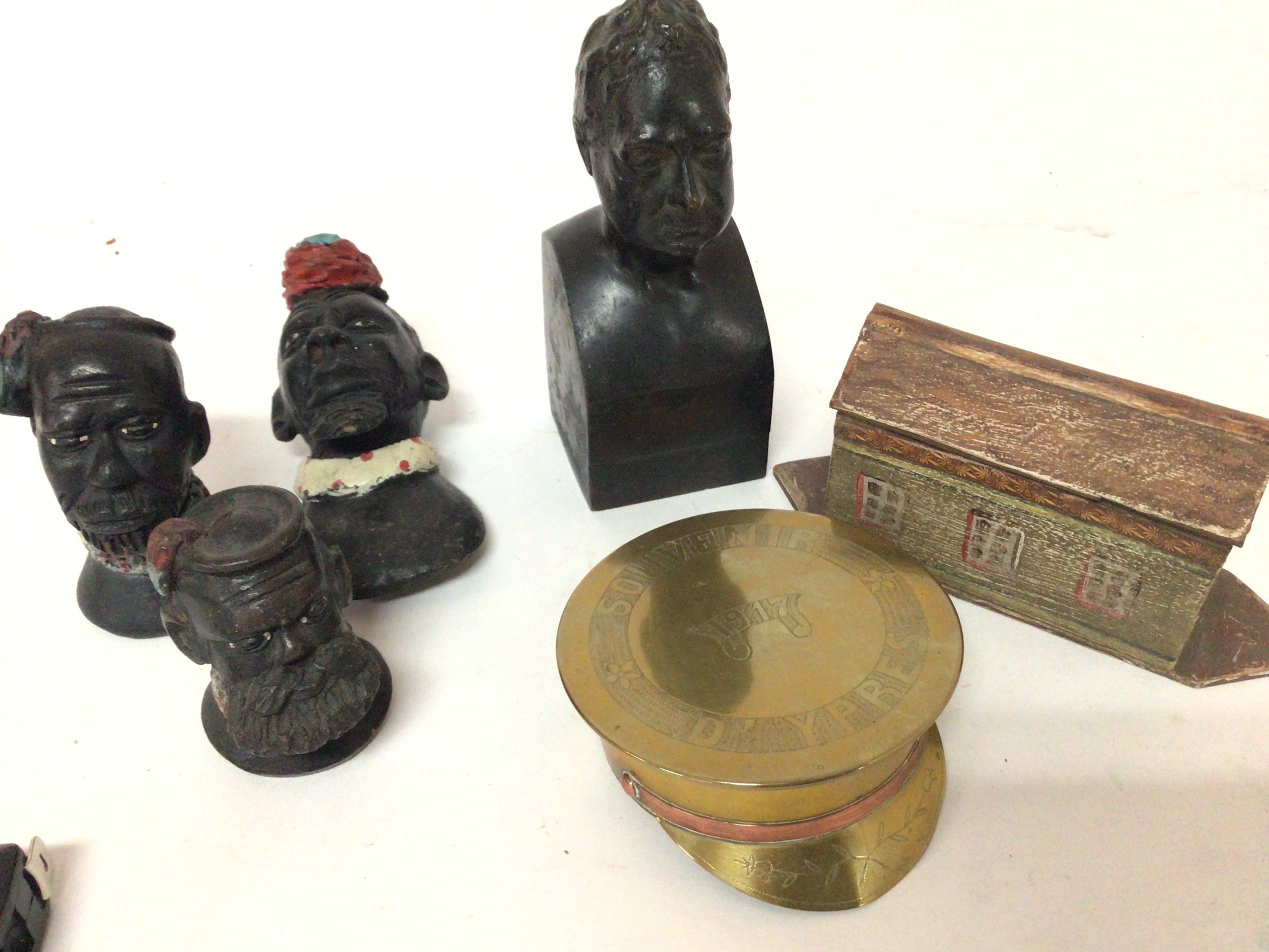 An 18th century small bronze bust a trench art brass Souvenier D Ypres and a miniature model of Noas Ark and other sculptures.