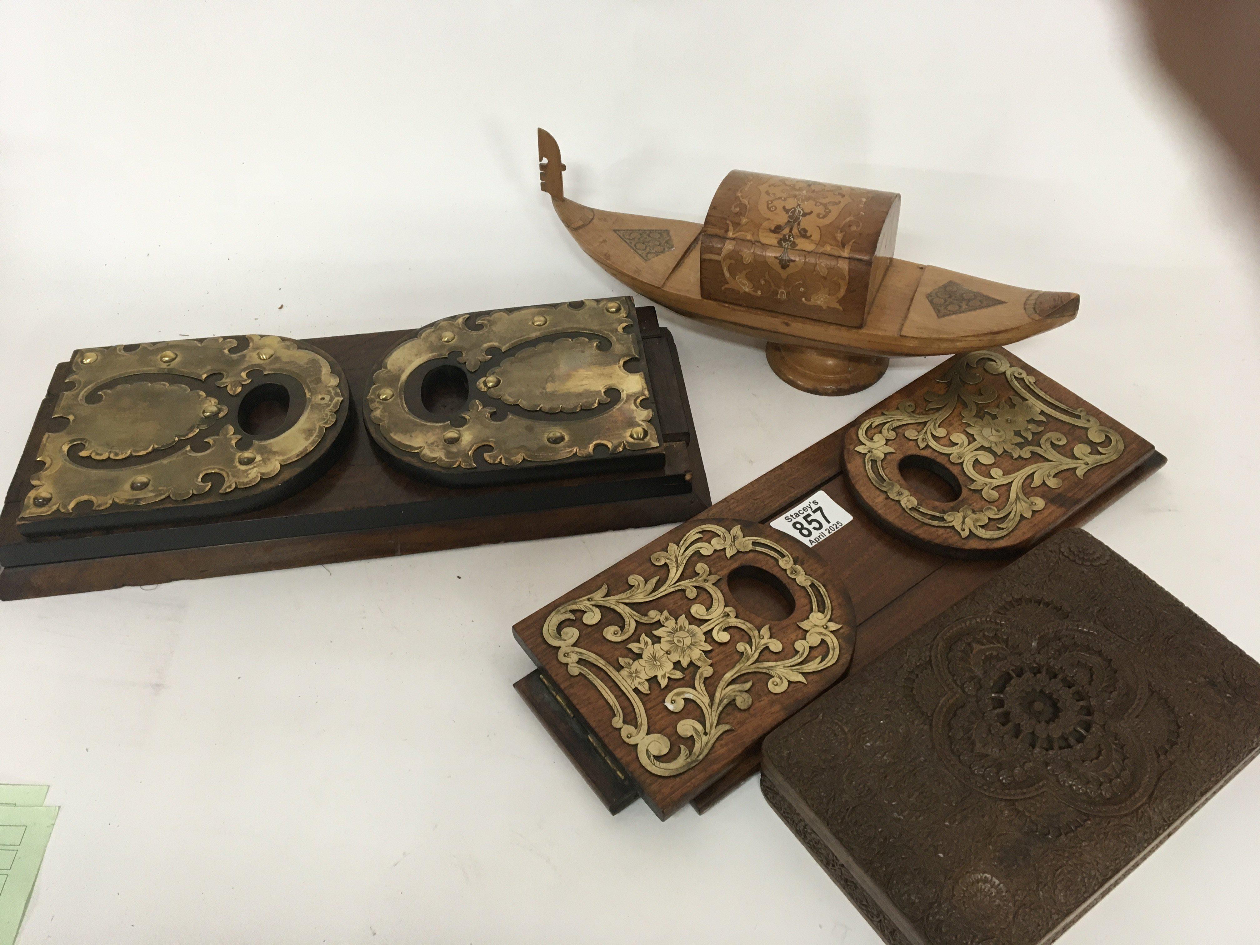 Two pairs of Victorian walnut and brass mounted extending book ends an Italian cigarette box and a profusely carved Indonesian cigarette box (4)