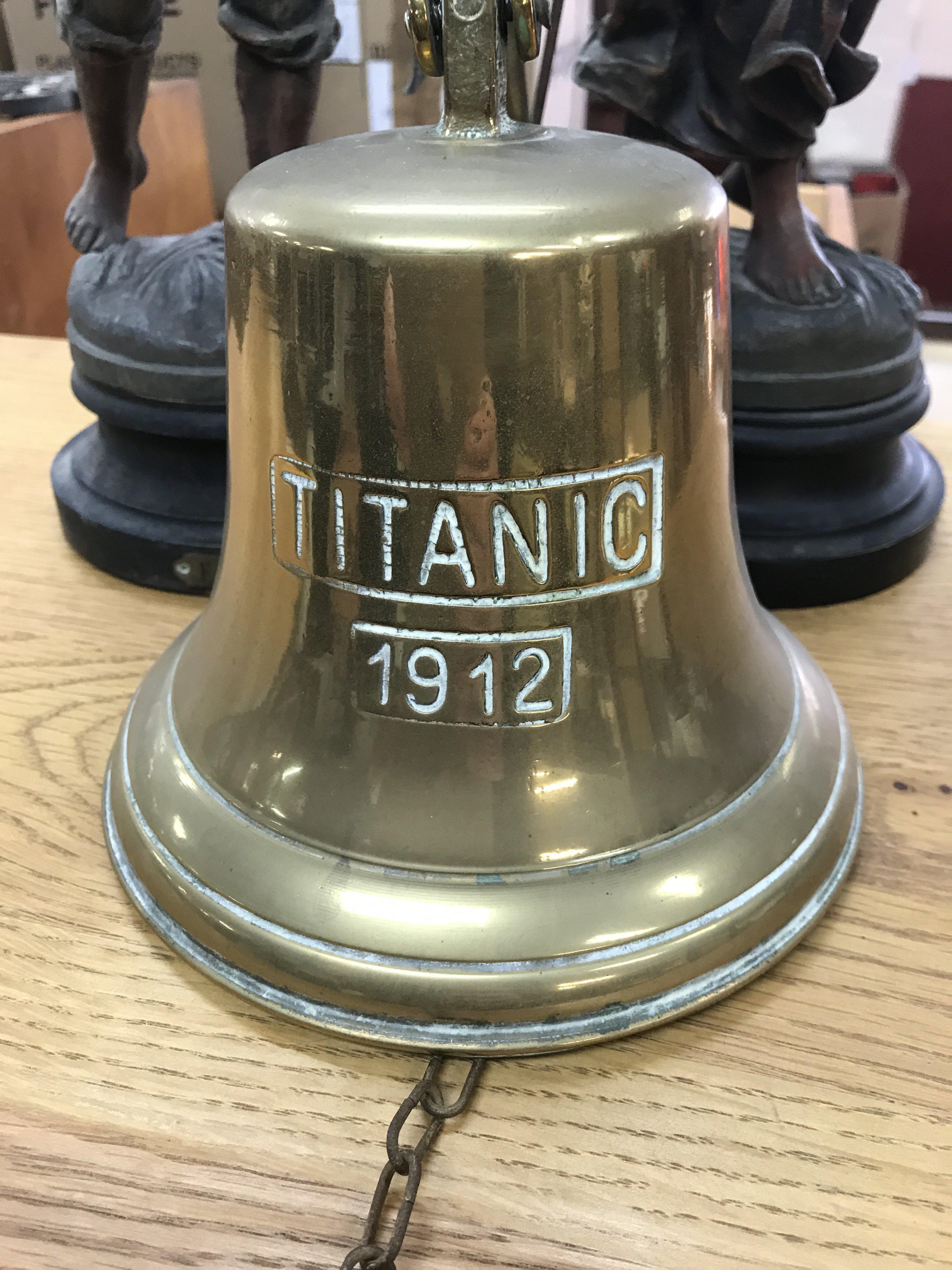 A brass Titanic bell .