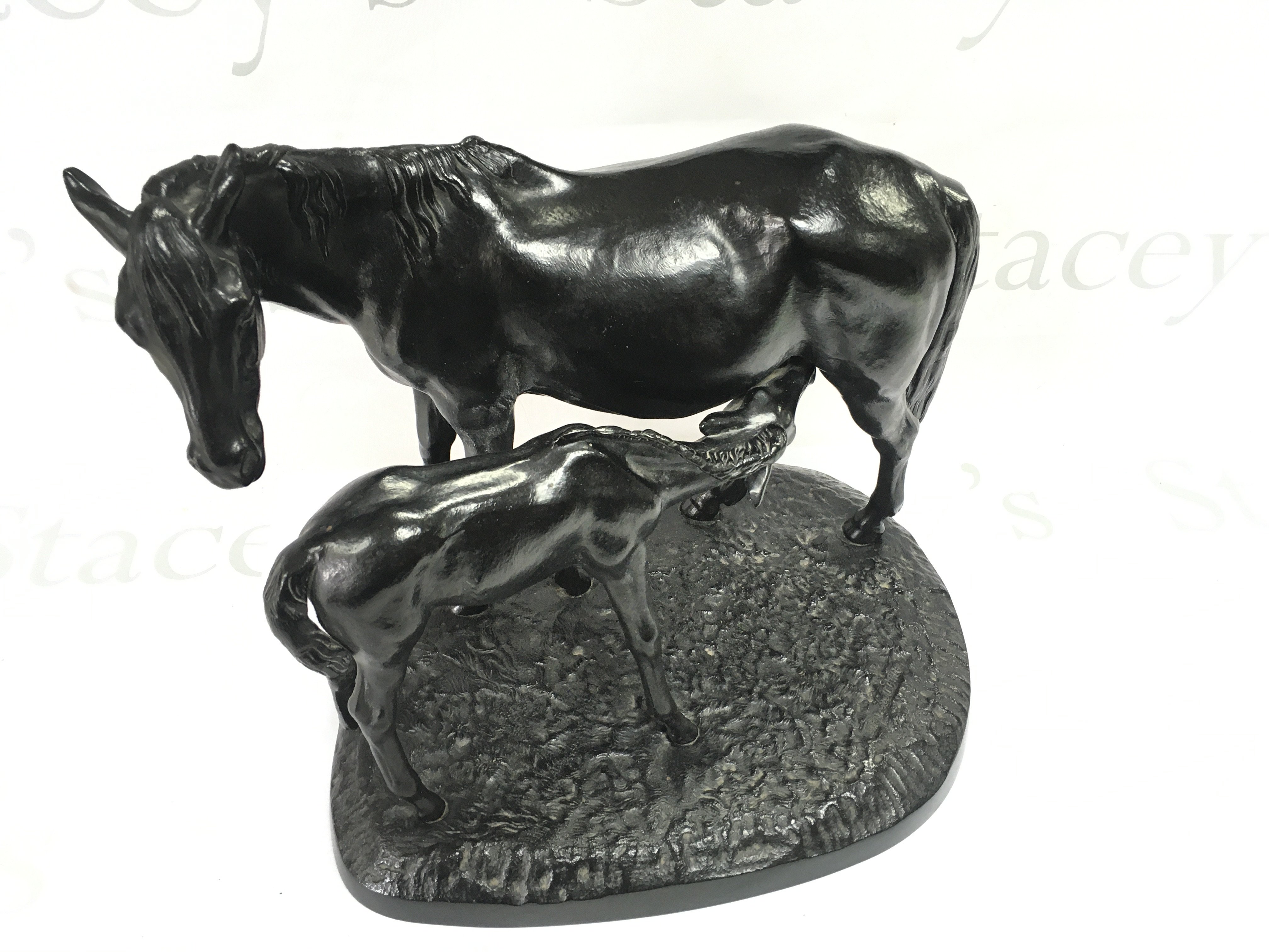 A 20th cast iron Russian model of a mare and foal. 38cm wide 28cm tall.