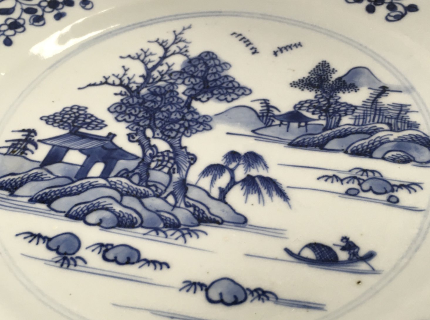 An 18th century Chinese octagonal blue and white plate decorated with a river scene , 23cm wide. Chips seen on plate. This lot cannot be posted NO RESERVE