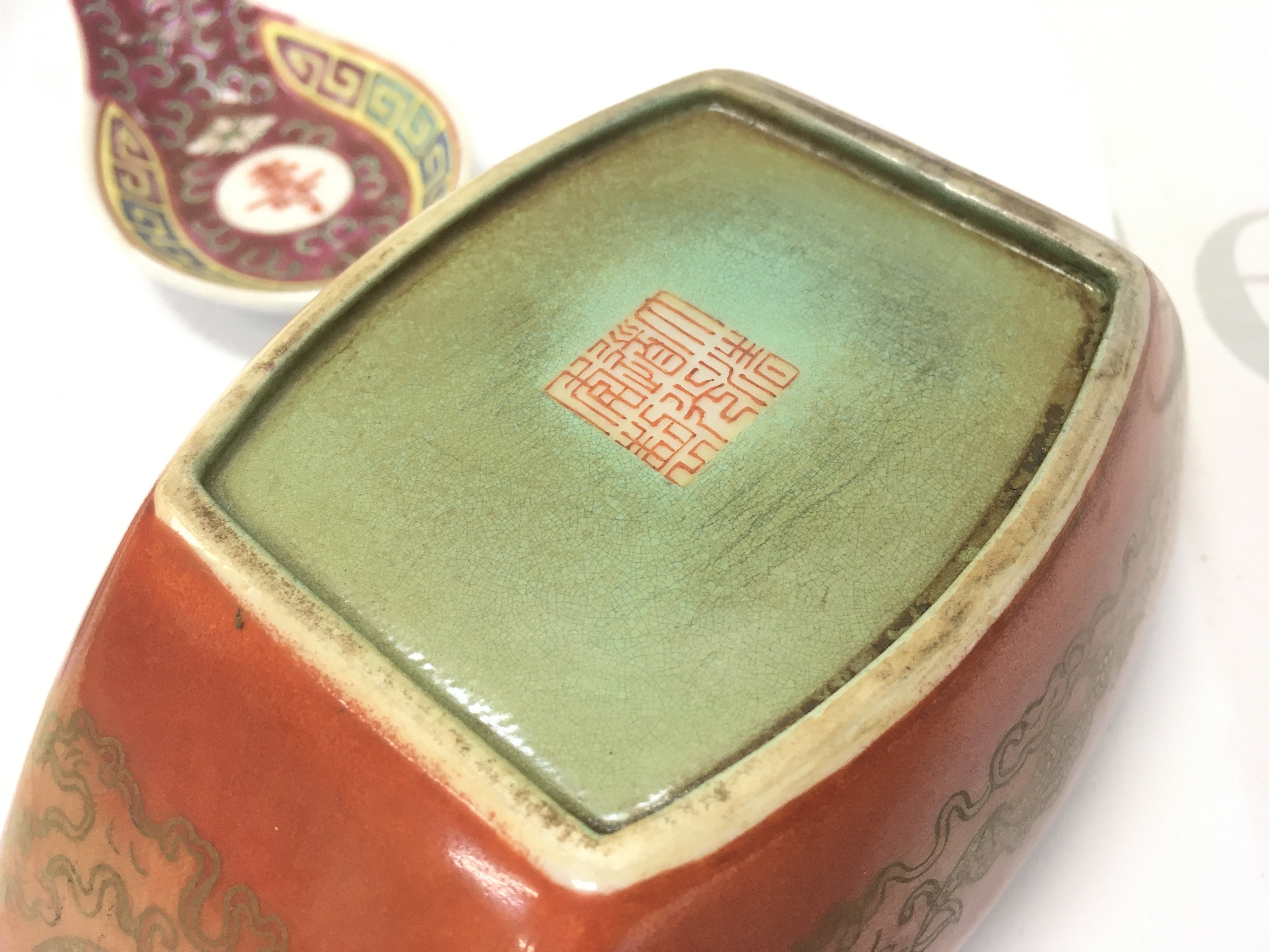 A Chinese ceramic soup bowl with gilt design, floral decoration, hand painted scene with figures and soup spoons . This lot cannot be posted