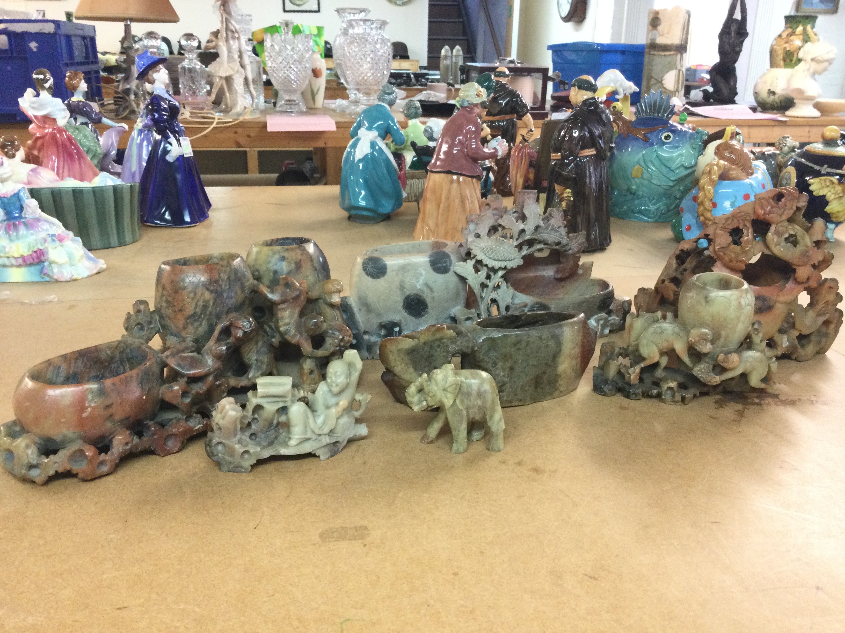 A collection of soapstone figures and ornaments , this lot cannot be posted