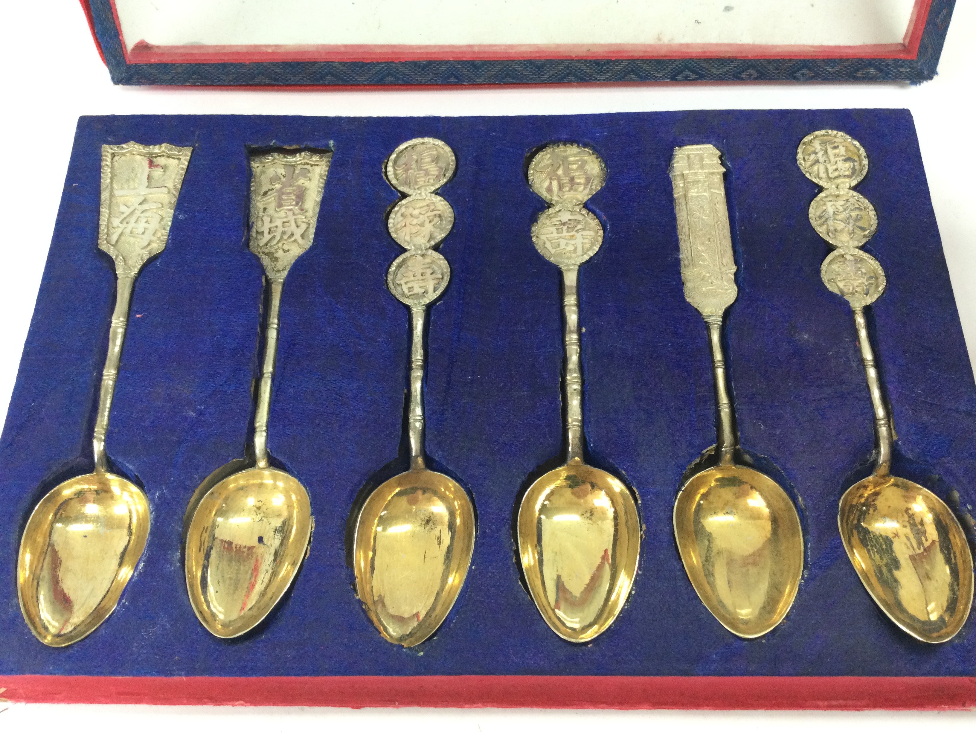 A cased set of silver Chinese spoons ,with case . This lot cannot be posted