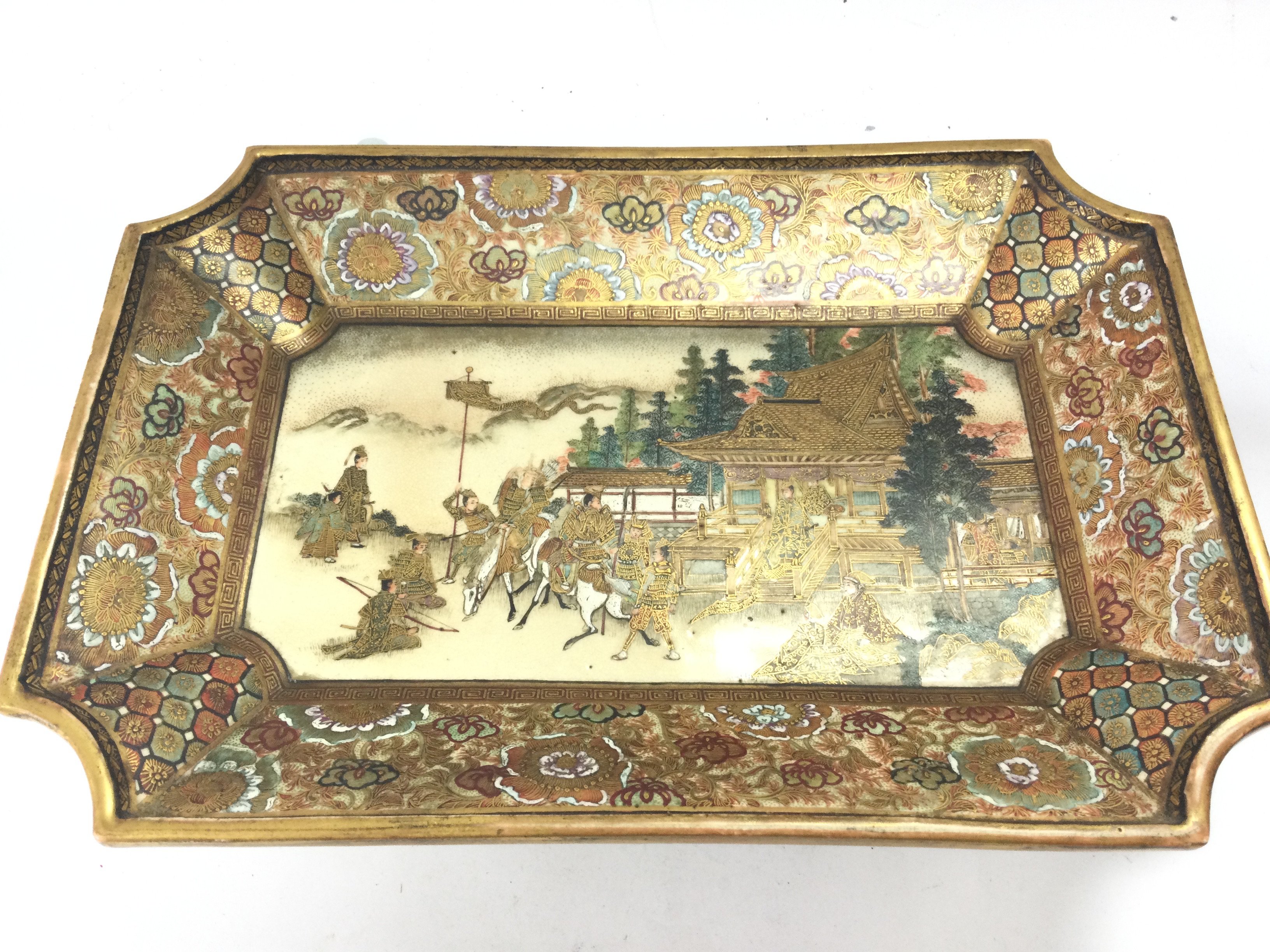 A Japanese Satsuma dish with figures at a temple scene decoration , dimensions 24x16cm . No obvious large damage or restoration.This lot cannot be posted